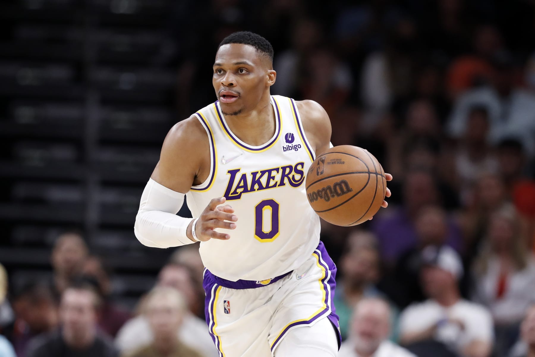 PHOENIX, ARIZONA - MARCH 13: Russell Westbrook #0 of the Los Angeles Lakers dribbles the ball during the first half against the Phoenix Suns at Footprint Center on March 13, 2022 in Phoenix, Arizona. The Suns beat the Lakers 140-111.  NOTE TO USER: User expressly acknowledges and agrees that, by downloading and or using this photograph, User is consenting to the terms and conditions of the Getty Images License Agreement.  (Photo by Chris Coduto/Getty Images)