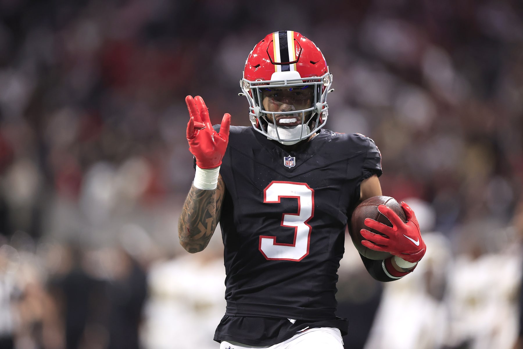 ATLANTA, GA - NOVEMBER 26: Atlanta Falcons safety Jessie Bates III (3) runs back an interception for a touchdown during the Week 12 NFL game between the Atlanta Falcons and the New Orleans Saints on November 26, 2023 at the Mercedes-Benz Stadium in Atlanta, Georgia.  (Photo by David J. Griffin/Icon Sportswire via Getty Images)