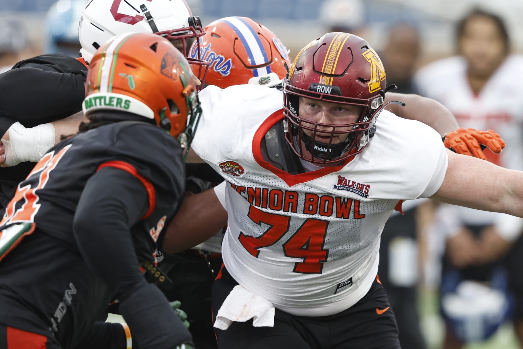 American offensive lineman John Michael Schmitz of Minnesota (74) runs through drills during practice for the Senior Bowl NCAA college football game Thursday, Feb. 2, 2023, in Mobile, Ala.. (AP Photo/Butch Dill)