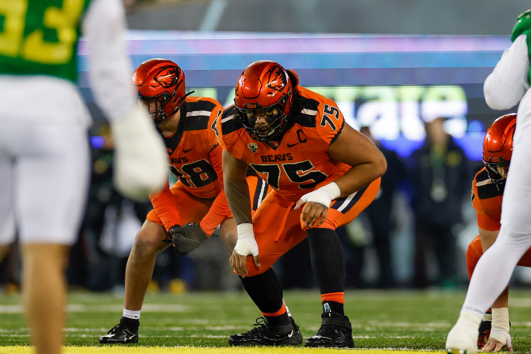 EUGENE, OREGON - NOVEMBER 24: Taliese Fuaga #75 of the Oregon State Beavers in an offensive stance during a game against the Oregon Ducks at Autzen Stadium on November 24, 2023 in Eugene, Oregon. (Photo by Brandon Sloter/Image Of Sport/Getty Images)