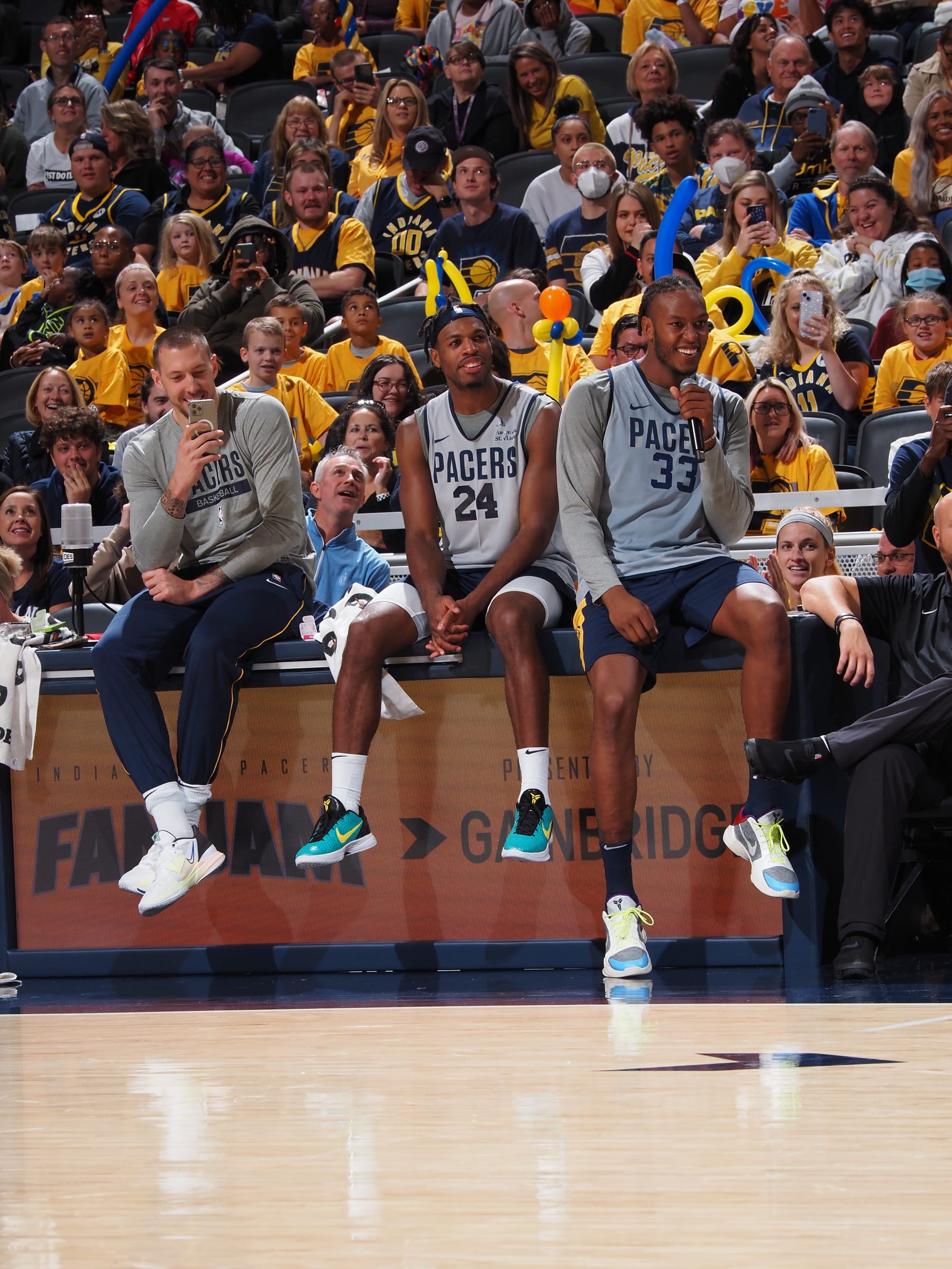 INDIANAPOLIS, IN - OCTOBER 9: Buddy Hield #24 and Myles Turner #33 of the Indiana Pacers smiles during the Pacers Fan Jam on October 9, 2022 at Gainbridge Fieldhouse in Indianapolis, Indiana. NOTE TO USER: User expressly acknowledges and agrees that, by downloading and or using this Photograph, user is consenting to the terms and conditions of the Getty Images License Agreement. Mandatory Copyright Notice: Copyright 2022 NBAE (Photo by Ron Hoskins/NBAE via Getty Images)