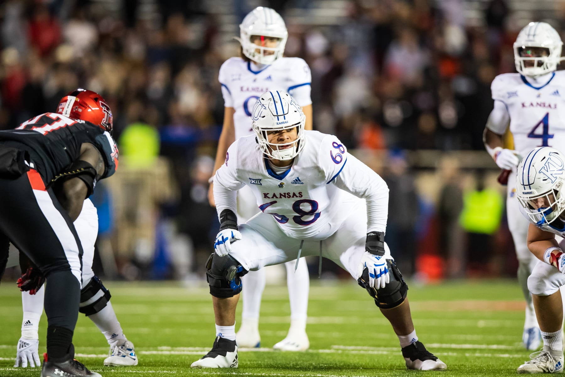 LUBBOCK, TEXAS - NOVEMBER 12: Offensive lineman Earl Bostick Jr. #68 of the Kansas Jayhawks lines up during the second half of the game against the Texas Tech Red Raiders at Jones AT&T Stadium on November 12, 2022 in Lubbock, Texas. (Photo by John E. Moore III/Getty Images)
