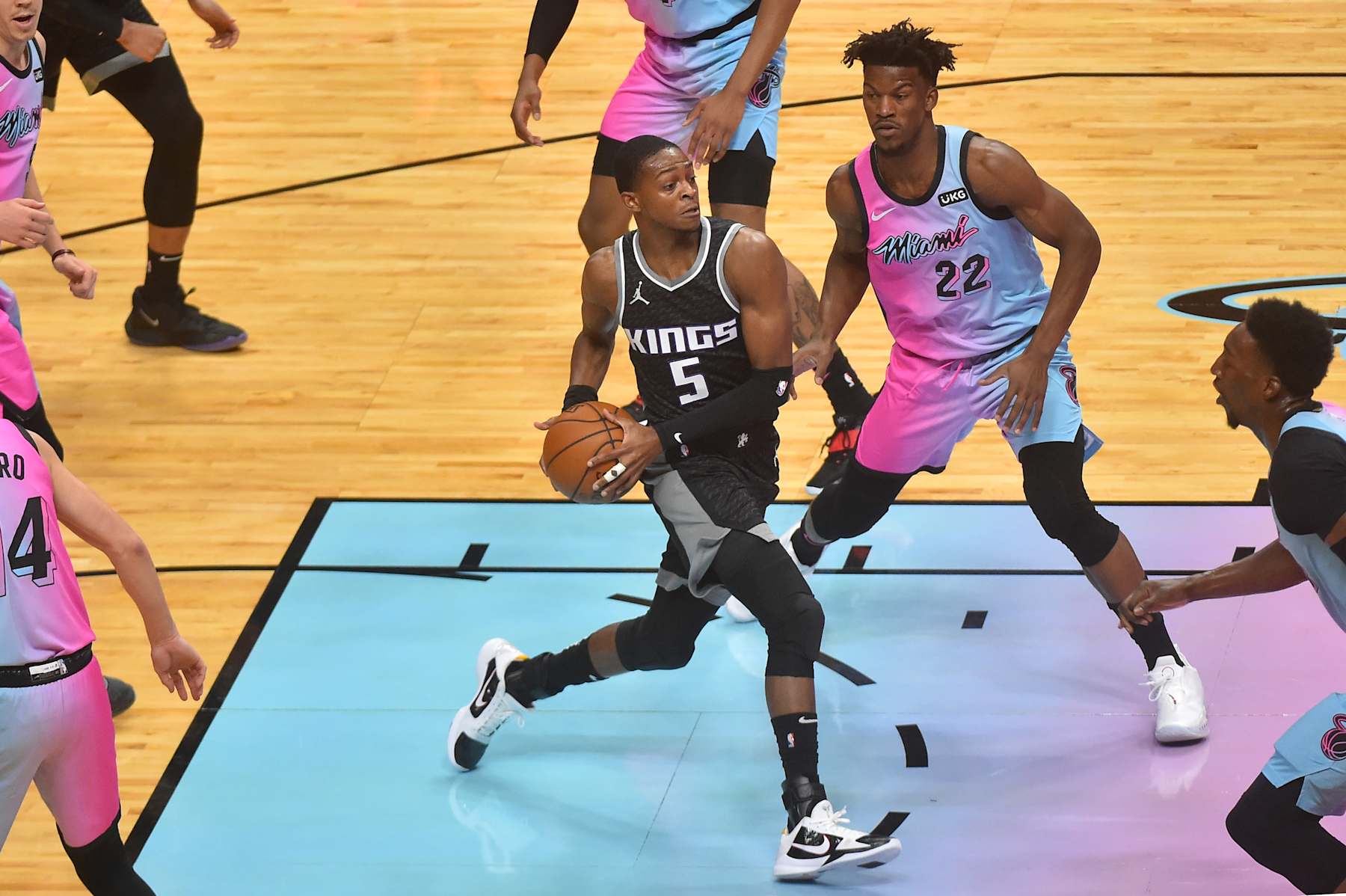 MIAMI, FL - JANUARY 30: DeAaron Fox #5 of the Sacramento Kings drives to the basket against Jimmy Butler #22 of the Miami Heat during the first quarter at American Airlines Arena on January 30, 2021 in Miami, Florida. NOTE TO USER: User expressly acknowledges and agrees that , by downloading and or using this photograph, User is consenting to the terms and conditions of the Getty Images License Agreement. (Photo by Eric Espada/Getty Images)