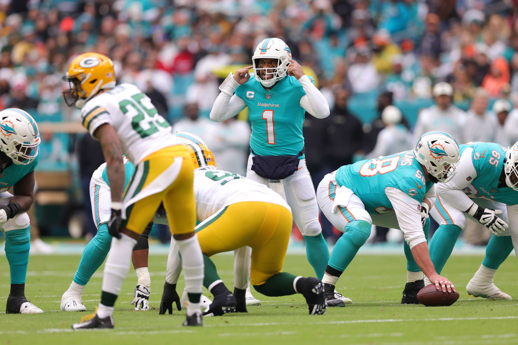 MIAMI GARDENS, FLORIDA - DECEMBER 25: Tua Tagovailoa #1 of the Miami Dolphins signals at the line of scrimmage during the first quarter of the game against the Green Bay Packers at Hard Rock Stadium on December 25, 2022 in Miami Gardens, Florida. (Photo by Megan Briggs/Getty Images)