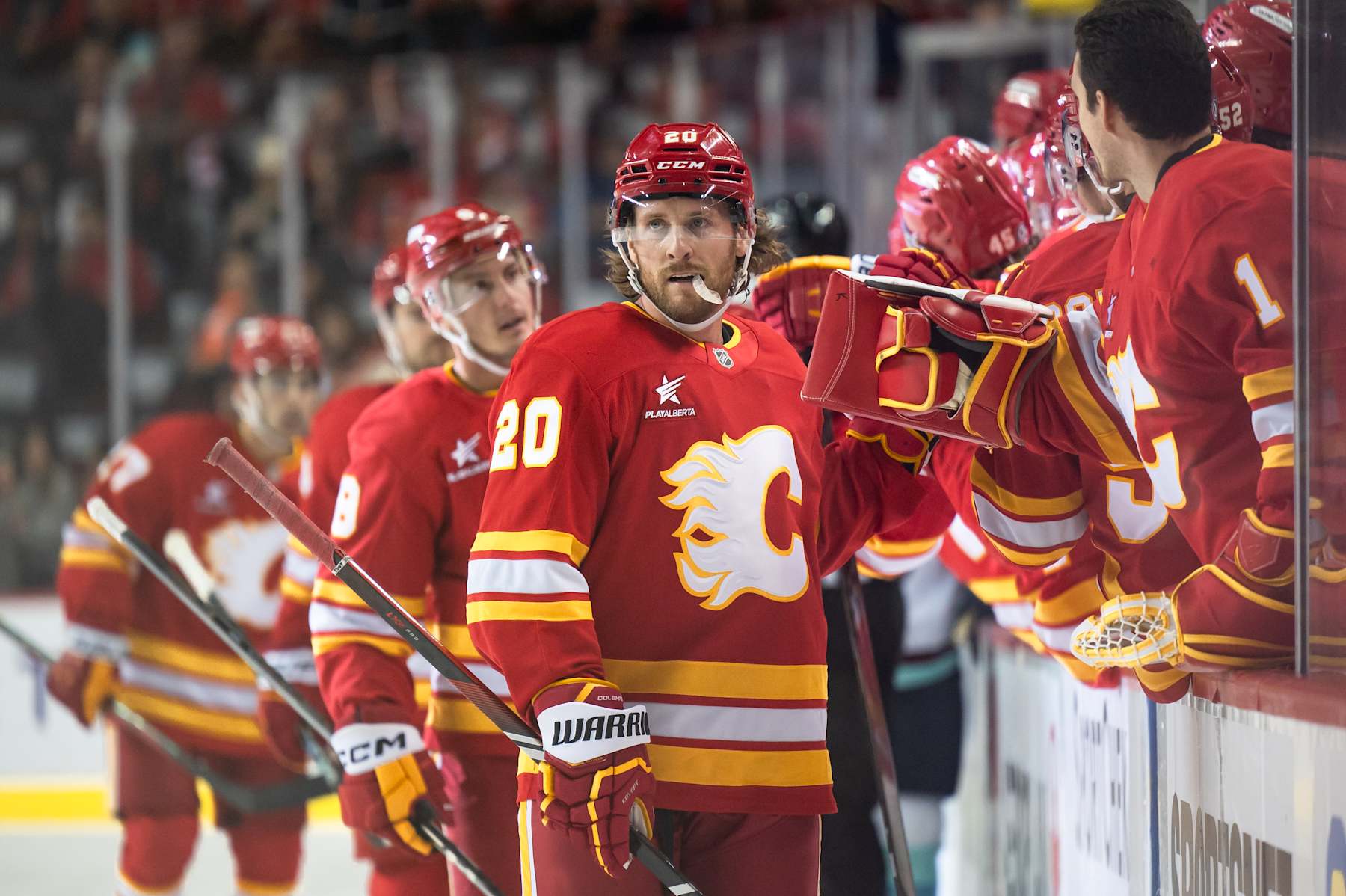 CALGARY, AB - SEPTEMBER 30: Calgary Flames Right Wing Blake Coleman (20) celebrates a goal with teammates during the first period of an NHL preseason game between the Calgary Flames and the Seattle Kraken on September 30, 2024, at the Scotiabank Saddledome in Calgary, AB. (Photo by Brett Holmes/Icon Sportswire via Getty Images)