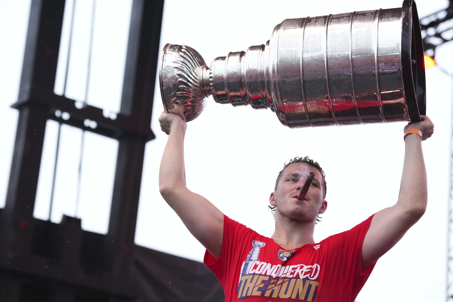FORT LAUDERDALE, FLORIDA - JUNE 30: Matthew Tkachuk #19 of the Florida Panthers hoists the Stanley Cup during the celebration for the Florida Panthers win of the Stanley Cup on June 30, 2024 in Fort Lauderdale, Florida. (Photo by Rich Storry/Getty Images)