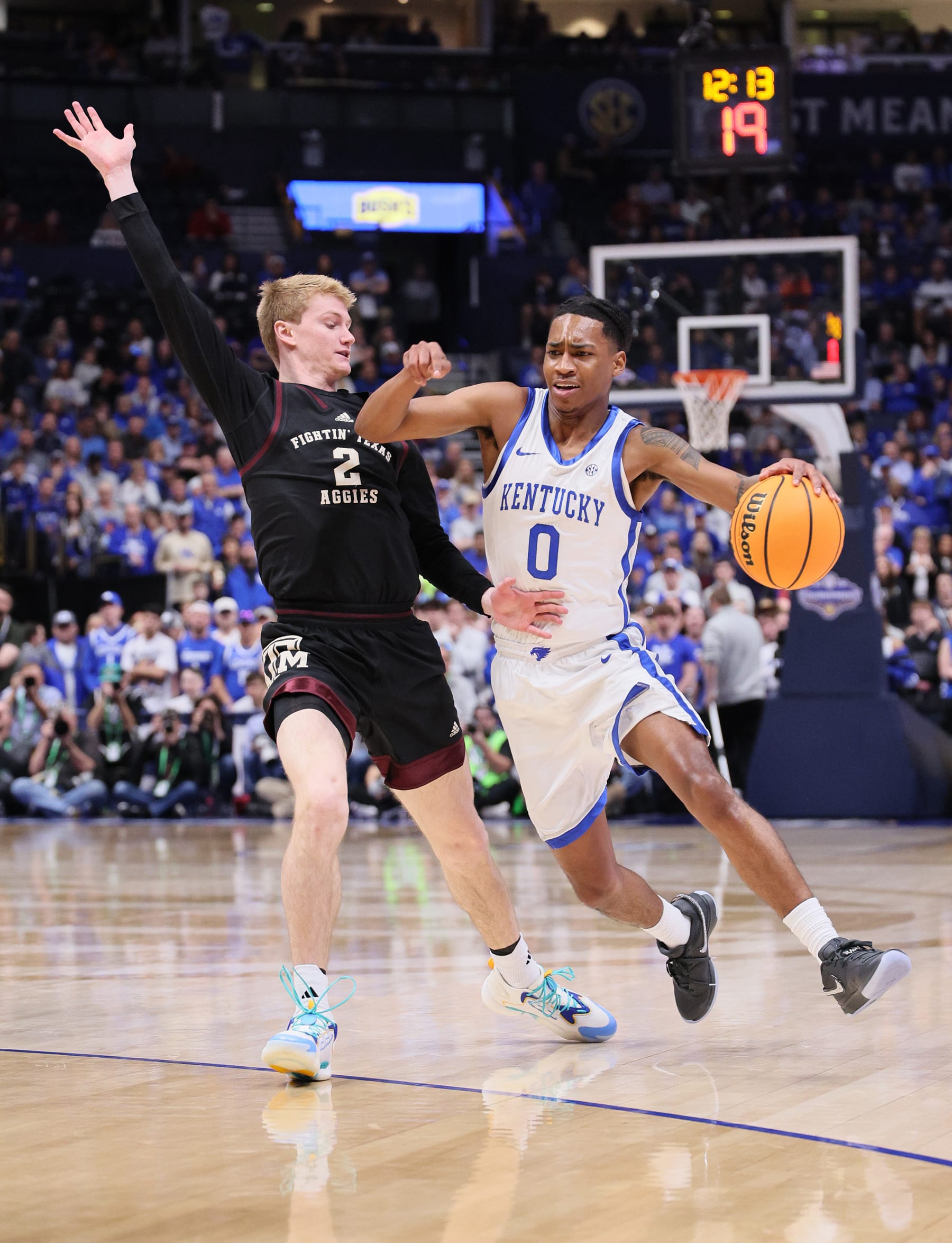 NASHVILLE, TENNESSEE - MARCH 15: Rob Dillingham #0 of the Kentucky Wildcats dribbles the ball in the first half against the Texas A&M Aggies during the quarterfinals of the SEC Basketball Tournament at Bridgestone Arena on March 15, 2024 in Nashville, Tennessee. (Photo by Andy Lyons/Getty Images)