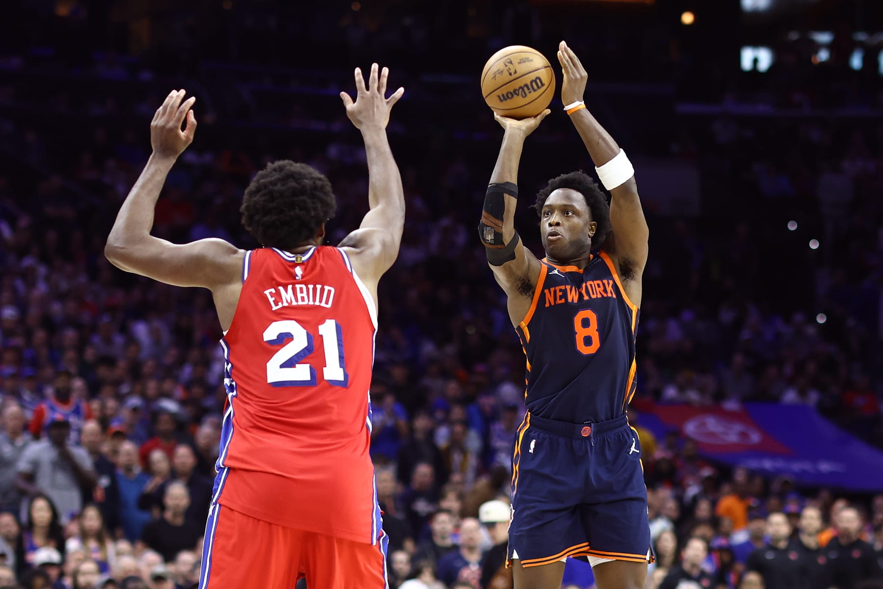 PHILADELPHIA, PENNSYLVANIA - APRIL 28: OG Anunoby #8 of the New York Knicks shoots past Joel Embiid #21 of the Philadelphia 76ers during the fourth quarter of game four of the Eastern Conference First Round Playoffs at the Wells Fargo Center on April 28, 2024 in Philadelphia, Pennsylvania. NOTE TO USER: User expressly acknowledges and agrees that, by downloading and/or using this Photograph, user is consenting to the terms and conditions of the Getty Images License Agreement. (Photo by Tim Nwachukwu/Getty Images)