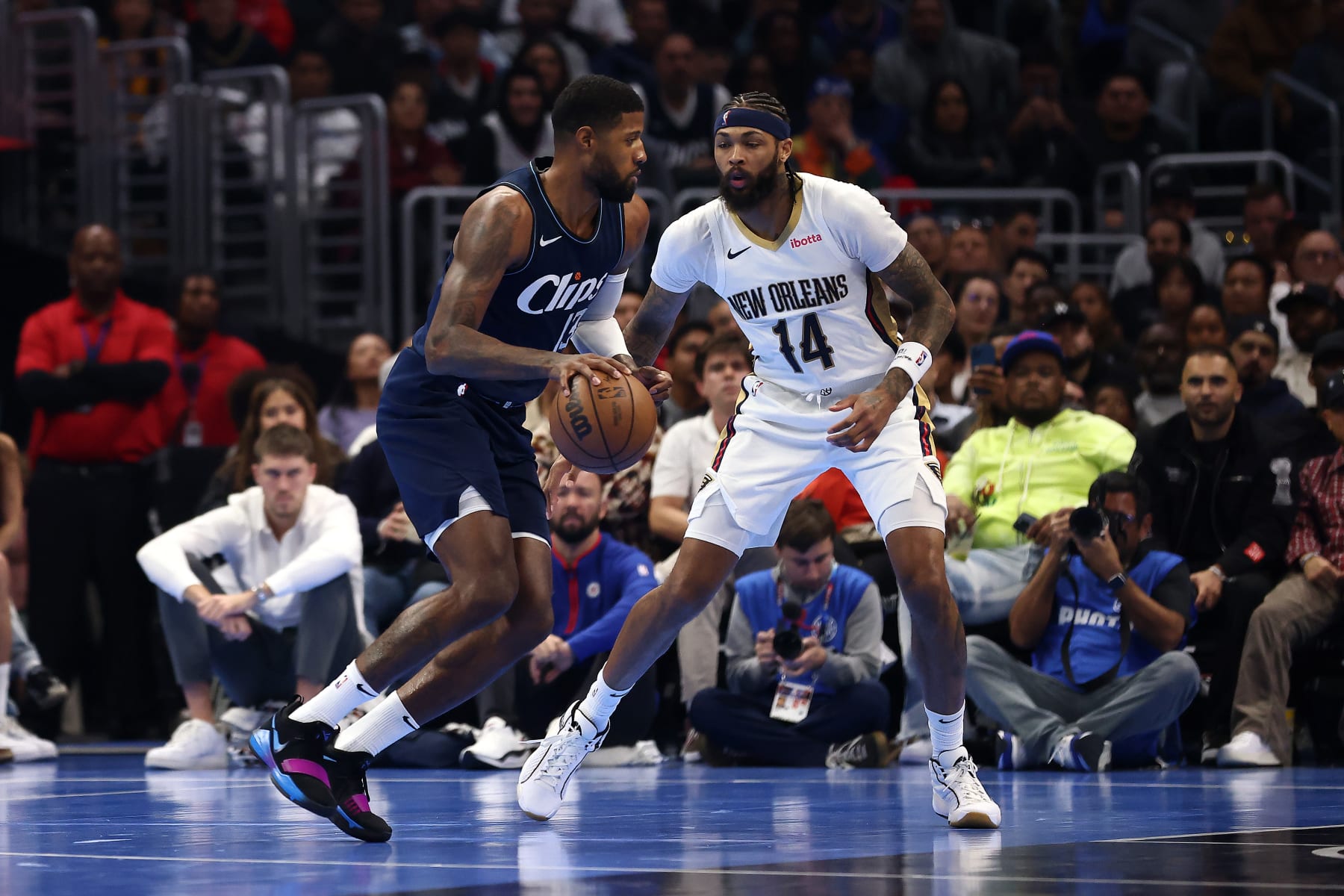 LOS ANGELES, CALIFORNIA - NOVEMBER 24: Paul George #13 of the Los Angeles Clippers handles the ball against Brandon Ingram #14 of the New Orleans Pelicans in the second quarter during an NBA In-Season Tournament game at Crypto.com Arena on November 24, 2023 in Los Angeles, California. NOTE TO USER: User expressly acknowledges and agrees that, by downloading and or using this photograph, User is consenting to the terms and conditions of the Getty Images License Agreement.  (Photo by Katelyn Mulcahy/Getty Images)