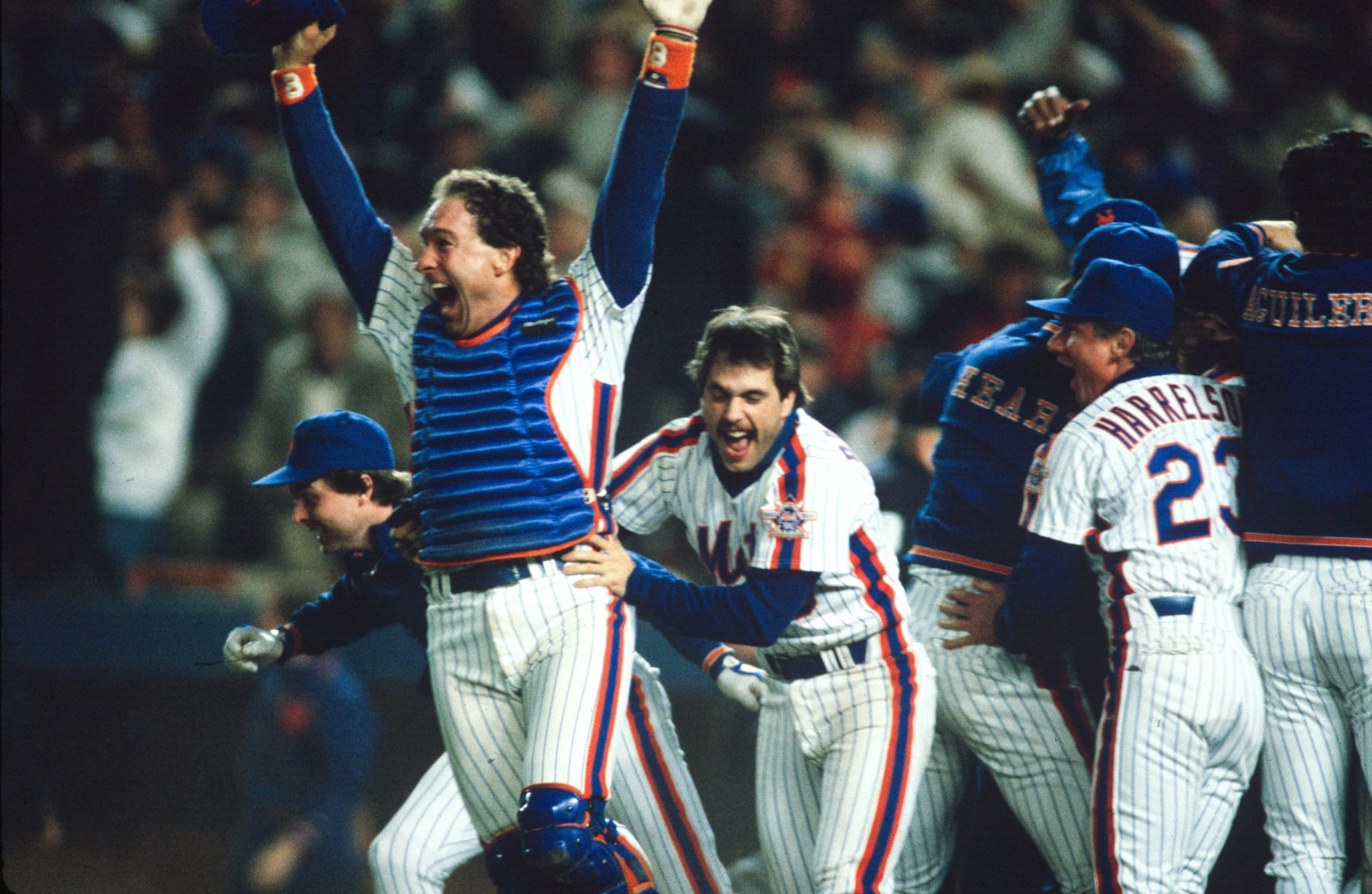NEW YORK , NY - OCTOBER 27:  Gary Carter #8 and Wally Backman #6 of New York Mets celebrate after winning the 1986 Major League Baseball World Series between the New York Mets and the Boston Red Sox during game seven on October 27, 1986 at 
Shea Stadium in the Flushing neighborhood of the Queens borough of New York City. The Mets won their second World Series, first in 1969, by beating the Red Sox 4-3. (Photo by MLB via Getty Images)