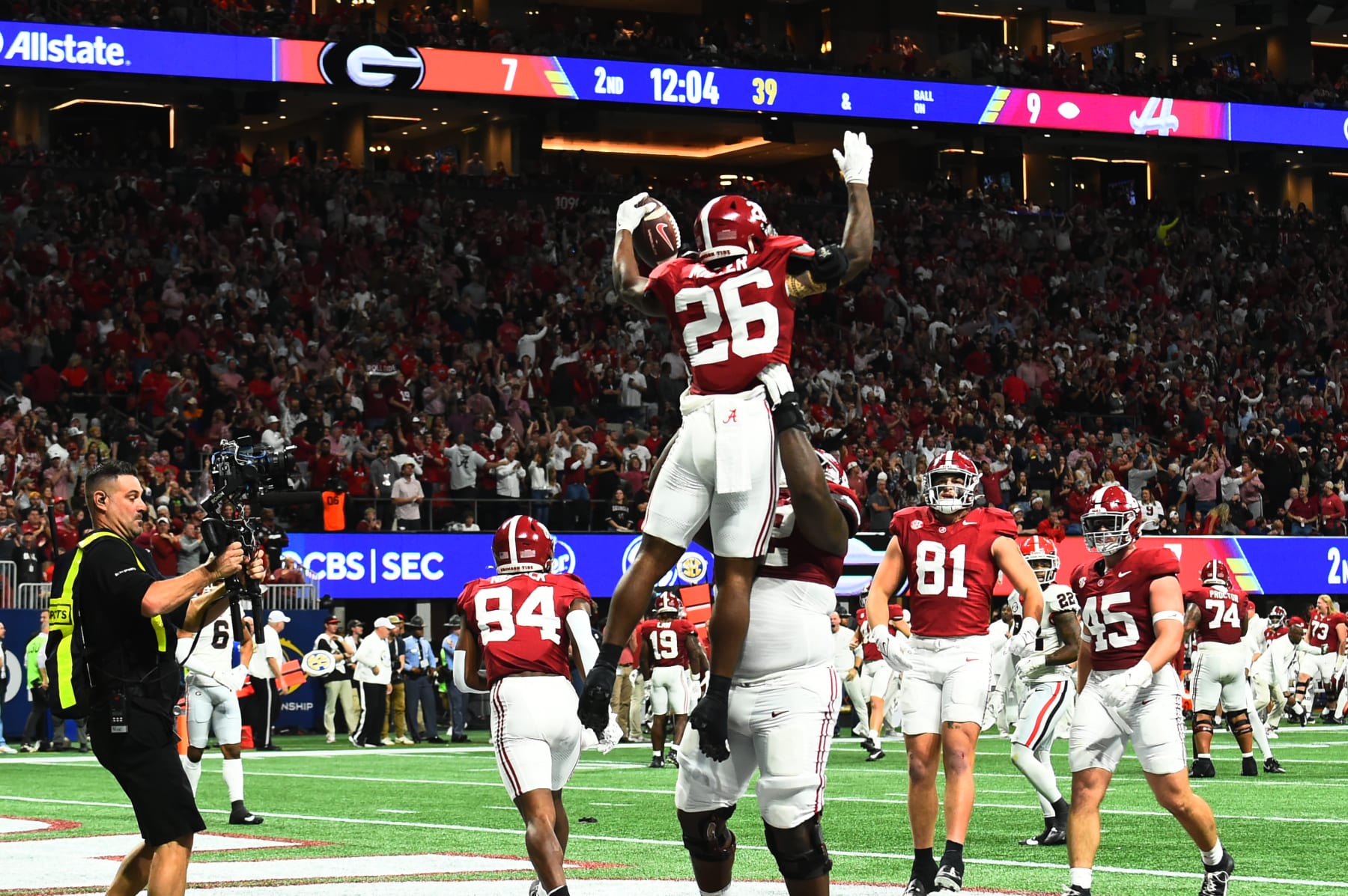 ATLANTA, GA - DECEMBER 02: Alabama Crimson Tide Running Back Jam Miller (26) celebrates during the SEC Championship Game between the Georgia Bulldogs and the Alabama Crimson Tide on December 02, 2023, at Mercedes-Benz Stadium in Atlanta, GA. (Photo by Jeffrey Vest/Icon Sportswire via Getty Images)