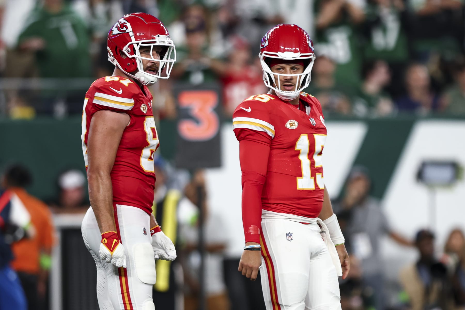 EAST RUTHERFORD, NJ - OCTOBER 1: Patrick Mahomes #15 of the Kansas City Chiefs stands on the field with Travis Kelce #87 during an NFL football game against the New York Jets at MetLife Stadium on October 1, 2023 in East Rutherford, New Jersey. (Photo by Kevin Sabitus/Getty Images)