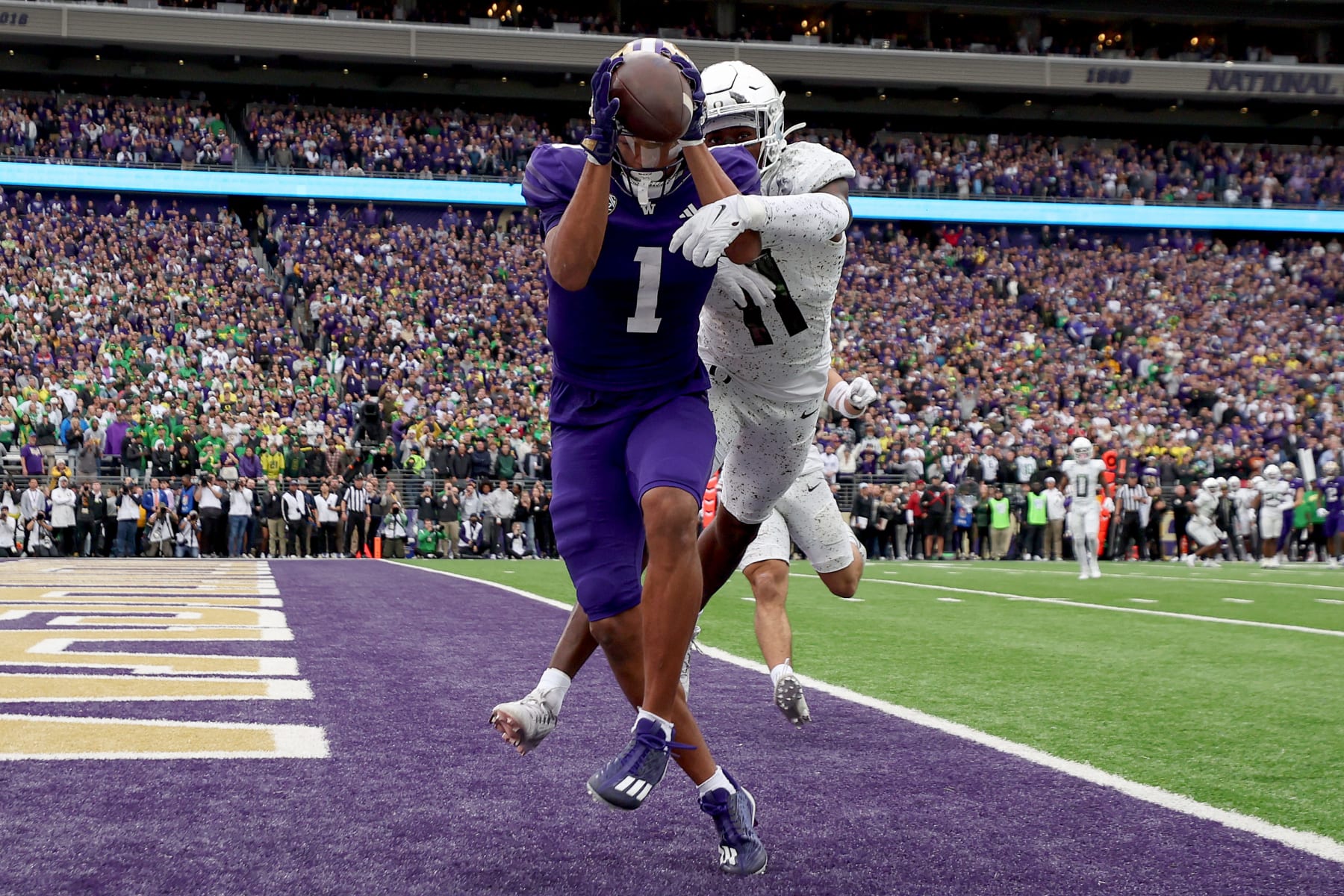 SEATTLE, WASHINGTON - OCTOBER 14: Rome Odunze #1 of the Washington Huskies catches a touchdown pass against the Oregon Ducks during the fourth quarter at Husky Stadium on October 14, 2023 in Seattle, Washington. (Photo by Steph Chambers/Getty Images)