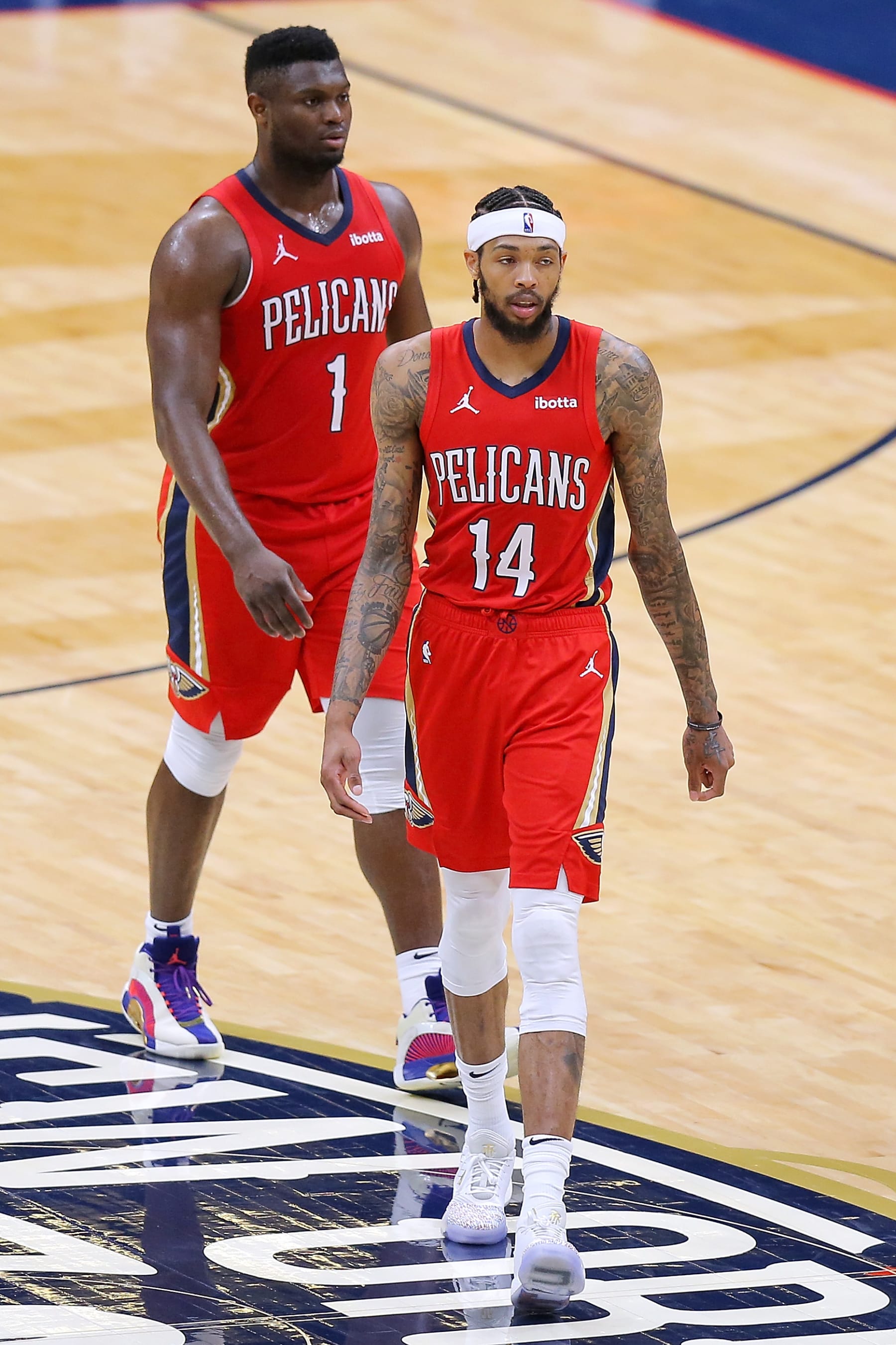 NEW ORLEANS, LOUISIANA - MARCH 27: Zion Williamson #1 of the New Orleans Pelicans and Brandon Ingram #14 react during a game at the Smoothie King Center on March 27, 2021 in New Orleans, Louisiana. NOTE TO USER: User expressly acknowledges and agrees that, by downloading and or using this Photograph, user is consenting to the terms and conditions of the Getty Images License Agreement. (Photo by Jonathan Bachman/Getty Images)