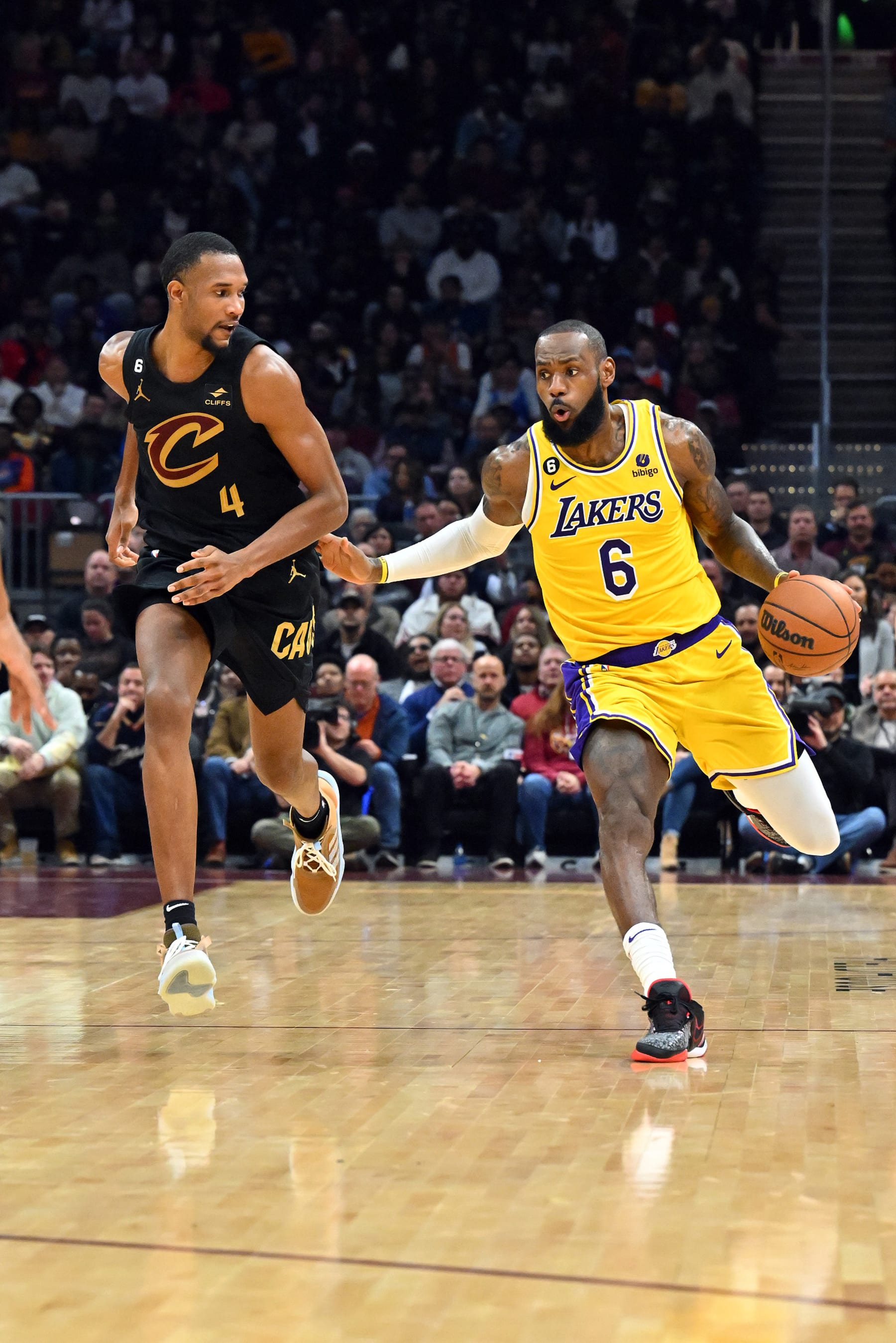 CLEVELAND, OHIO - DECEMBER 06: Evan Mobley #4 of the Cleveland Cavaliers guards LeBron James #6 of the Los Angeles Lakers during the third quarter at Rocket Mortgage Fieldhouse on December 06, 2022 in Cleveland, Ohio. The Cavaliers defeated the Lakers 115-100. NOTE TO USER: User expressly acknowledges and agrees that, by downloading and or using this photograph, User is consenting to the terms and conditions of the Getty Images License Agreement. (Photo by Jason Miller/Getty Images)