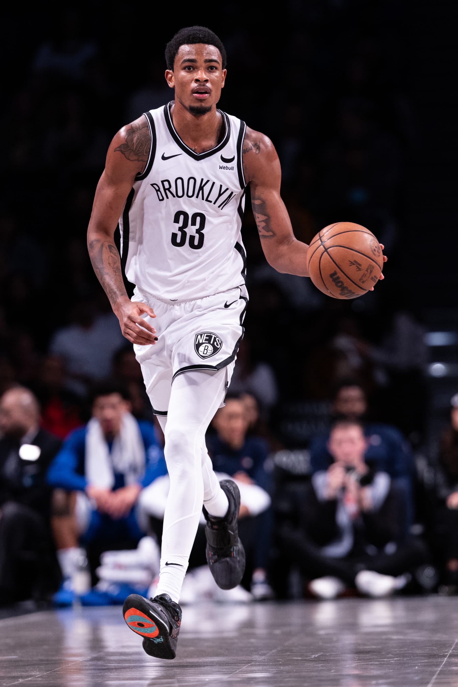 NEW YORK, NEW YORK - OCTOBER 16: Nic Claxton #33 of the Brooklyn Nets brings the ball up the court during the second quarter of the preseason game against the Philadelphia 76ers at Barclays Center on October 16, 2023 in New York City. NOTE TO USER: User expressly acknowledges and agrees that, by downloading and or using this photograph, User is consenting to the terms and conditions of the Getty Images License Agreement. (Photo by Dustin Satloff/Getty Images)