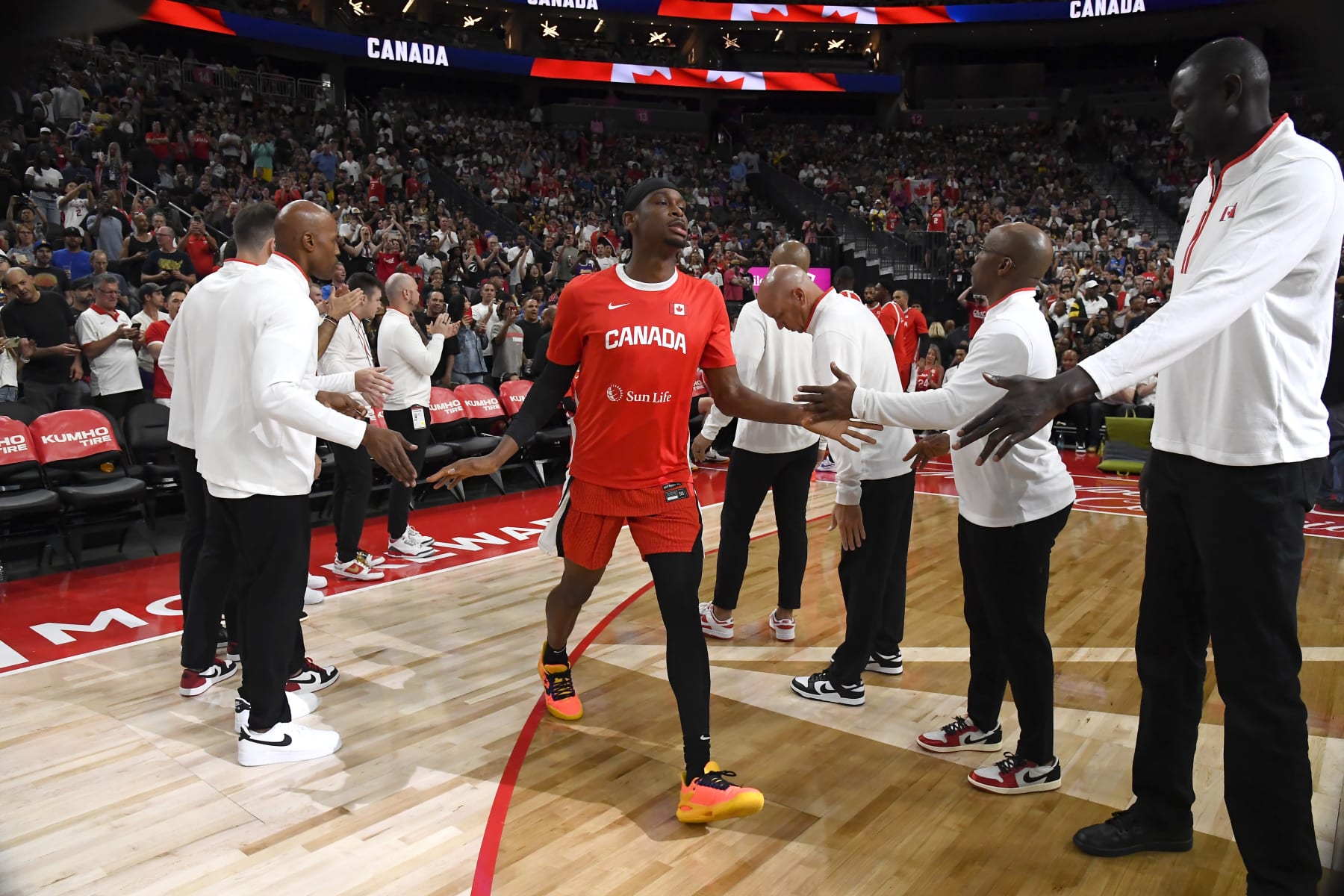 LAS VEGAS, NV - JULY 10: Shai Gilgeous-Alexander #2 of Team Canada high fives before the game against Team USA on July 10, 2024 at the T-Mobile Arena in Las Vegas, Nevada. NOTE TO USER: User expressly acknowledges and agrees that, by downloading and/or using this Photograph, user is consenting to the terms and conditions of the Getty Images License Agreement. Mandatory Copyright Notice: Copyright 2024 NBAE (Photo by Brian Babineau/NBAE via Getty Images)