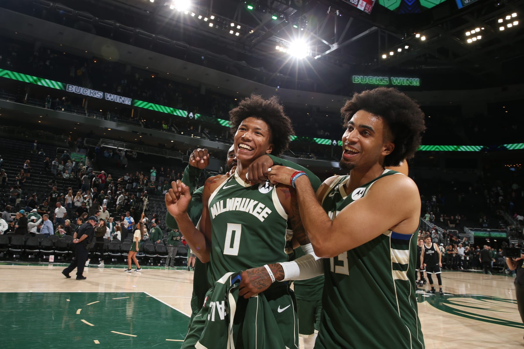 MILWAUKEE, WI - OCTOBER 22: Marjon Beauchamp #0 and and Jordan Nwora #13 of the Milwaukee Bucks smile after the game against the Houston Rockets on October 22, 2022 at the Fiserv Forum Center in Milwaukee, Wisconsin. NOTE TO USER: User expressly acknowledges and agrees that, by downloading and or using this Photograph, user is consenting to the terms and conditions of the Getty Images License Agreement. Mandatory Copyright Notice: Copyright 2022 NBAE (Photo by Gary Dineen/NBAE via Getty Images).