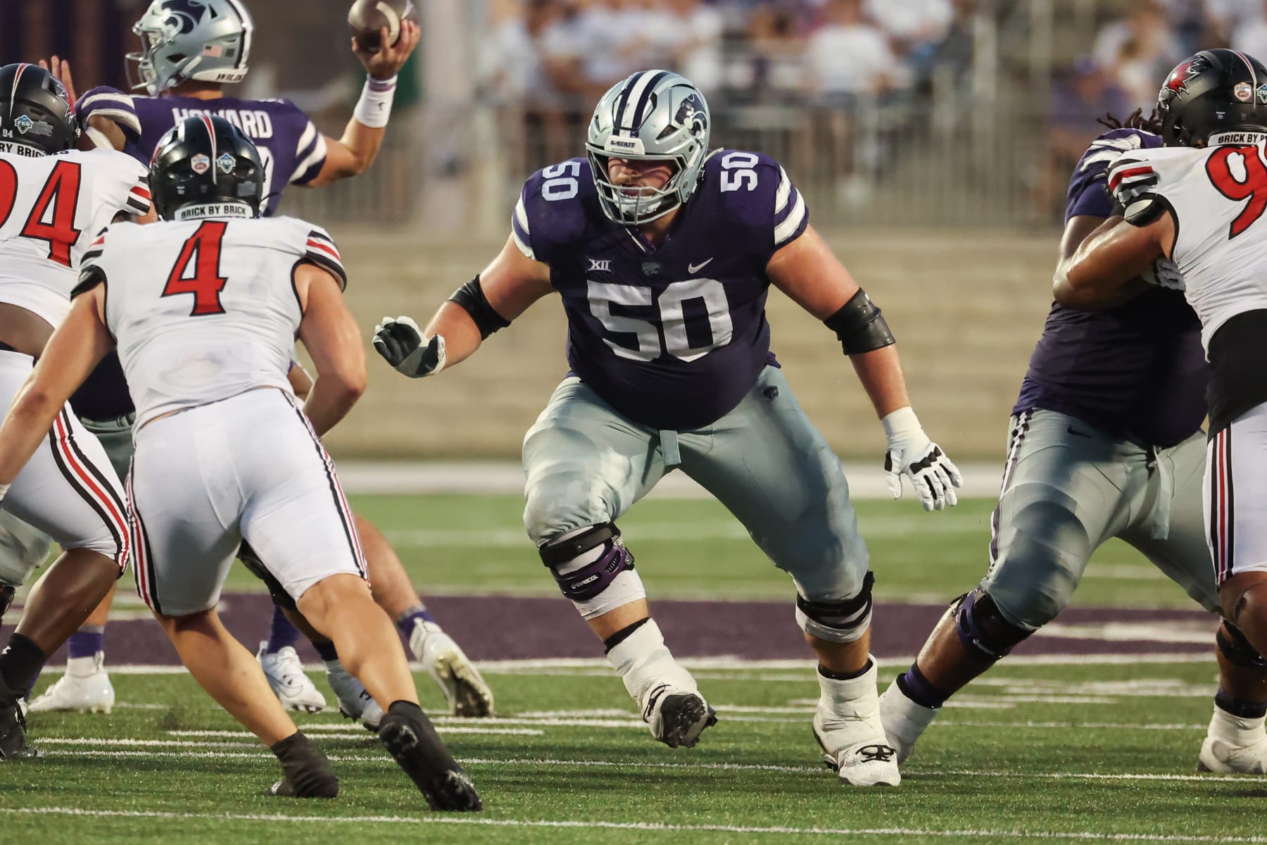 MANHATTAN, KS - SEPTEMBER 02: Kansas State Wildcats offensive lineman Cooper Beebe (50) looks to block in the fourth quarter of a college football game between the Southeast Missouri Redhawks and the Kansas State Wildcats on Sep 2, 2023 at Bill Snyder Family Stadium in Manhattan, KS.  (Photo by Scott Winters/Icon Sportswire via Getty Images)