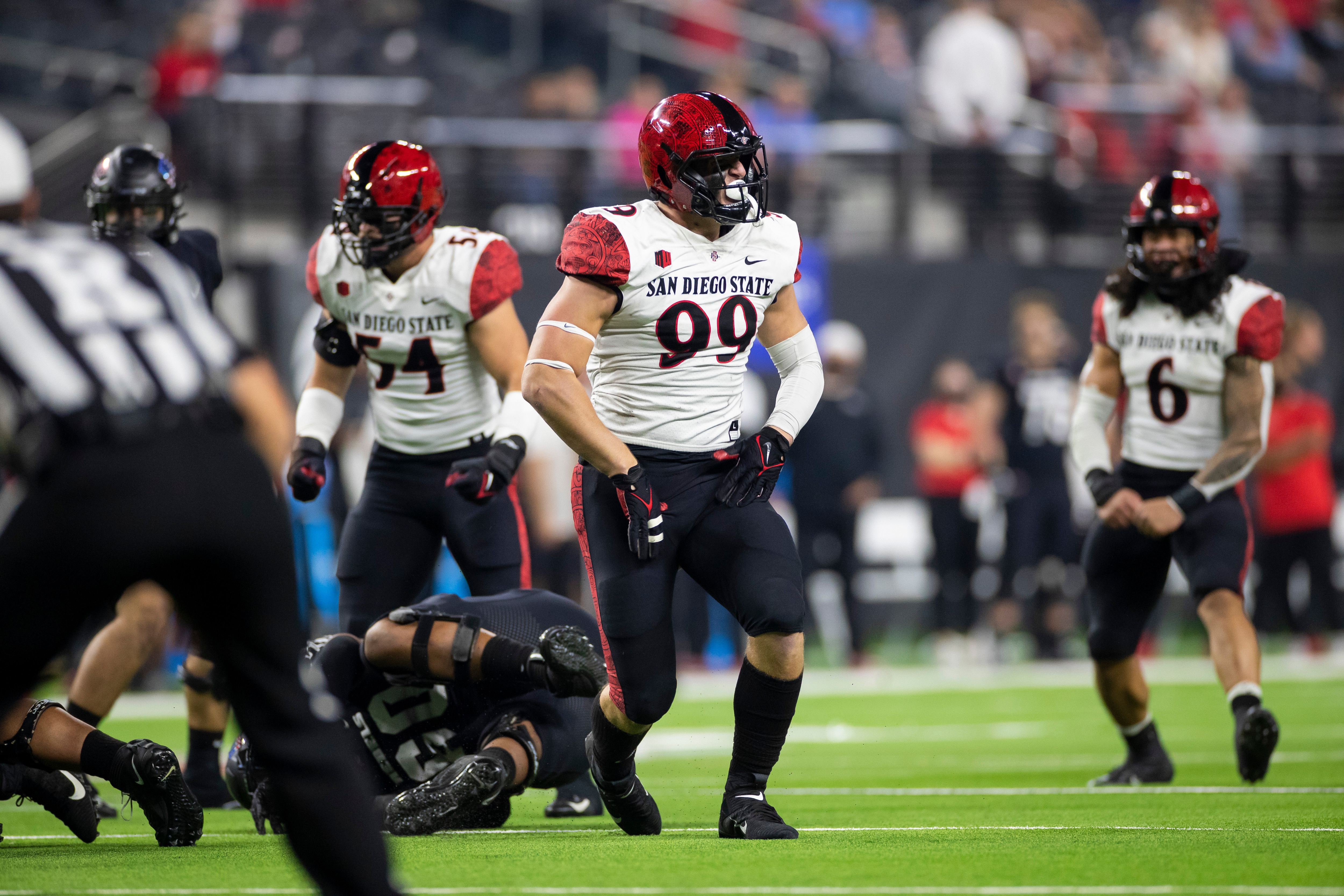 LAS VEGAS, NV - NOVEMBER 19: San Diego State Aztecs defensive linemen Cameron Thomas (99) celebrates a sack during a college football game against the UNLV Rebels on November 19, 2021 at Allegiant Stadium in Las Vegas, Nevada. (Photo by Brandon Sloter/Icon Sportswire via Getty Images)