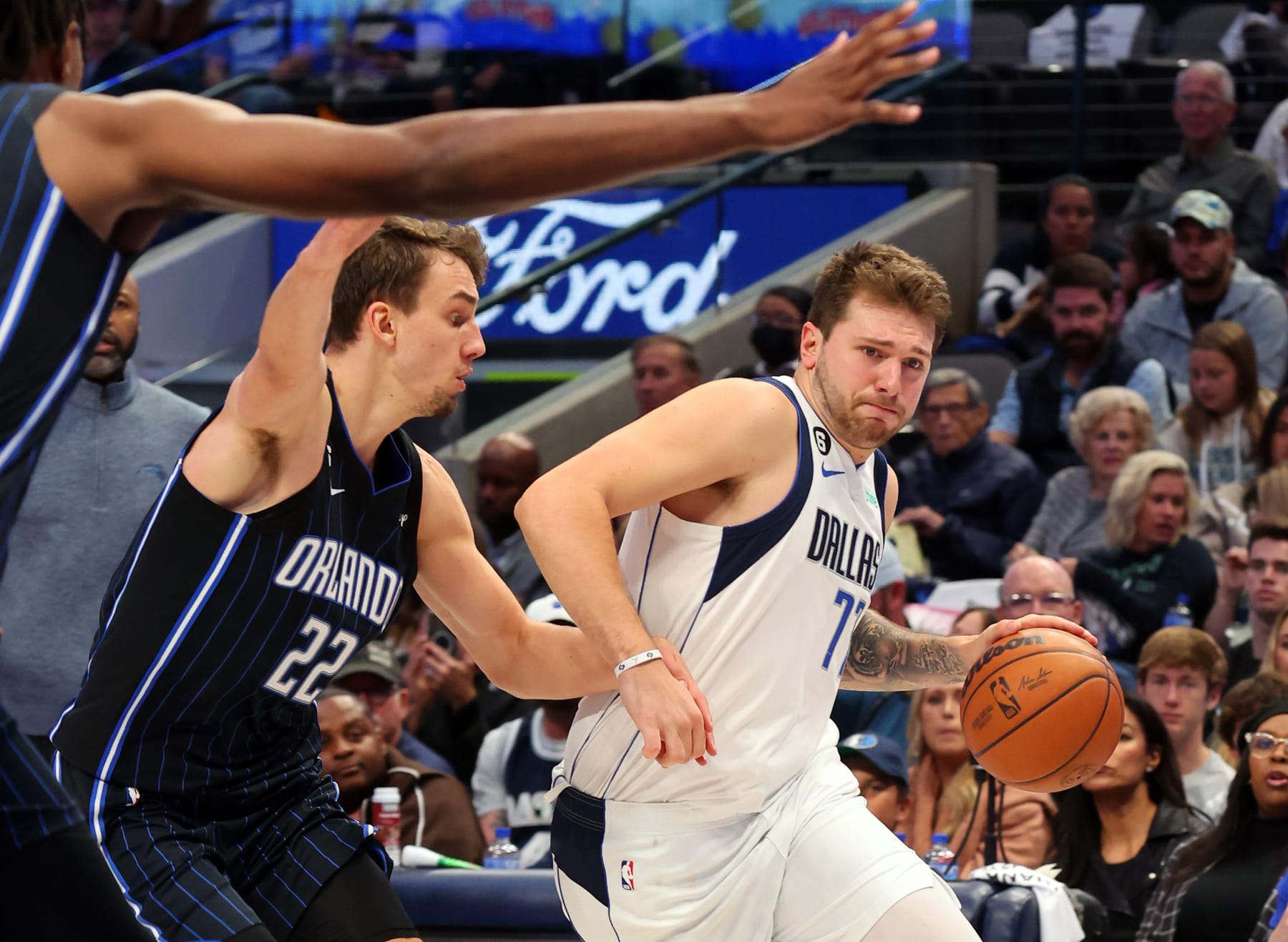 DALLAS, TEXAS - OCTOBER 30:  Luka Doncic #77 of the Dallas Mavericks drives against Franz Wagner #22 of the Orlando Magic in the second half at American Airlines Center on October 30, 2022 in Dallas, Texas. NOTE TO USER: User expressly acknowledges and agrees that, by downloading and/or using this Photograph, user is consenting to the terms and conditions of the Getty Images License Agreement. (Photo by Richard Rodriguez/Getty Images)