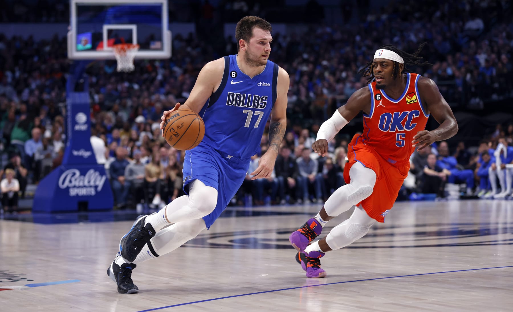 DALLAS, TX - OCTOBER 29: Luka Doncic #77 of the Dallas Mavericks handles the ball as Luguentz Dort #5 of the Oklahoma City Thunder defends at American Airlines Center on October 29, 2022 in Dallas, Texas. NOTE TO USER: User expressly acknowledges and agrees that, by downloading and or using this photograph, User is consenting to the terms and conditions of the Getty Images License Agreement. (Photo by Ron Jenkins/Getty Images)