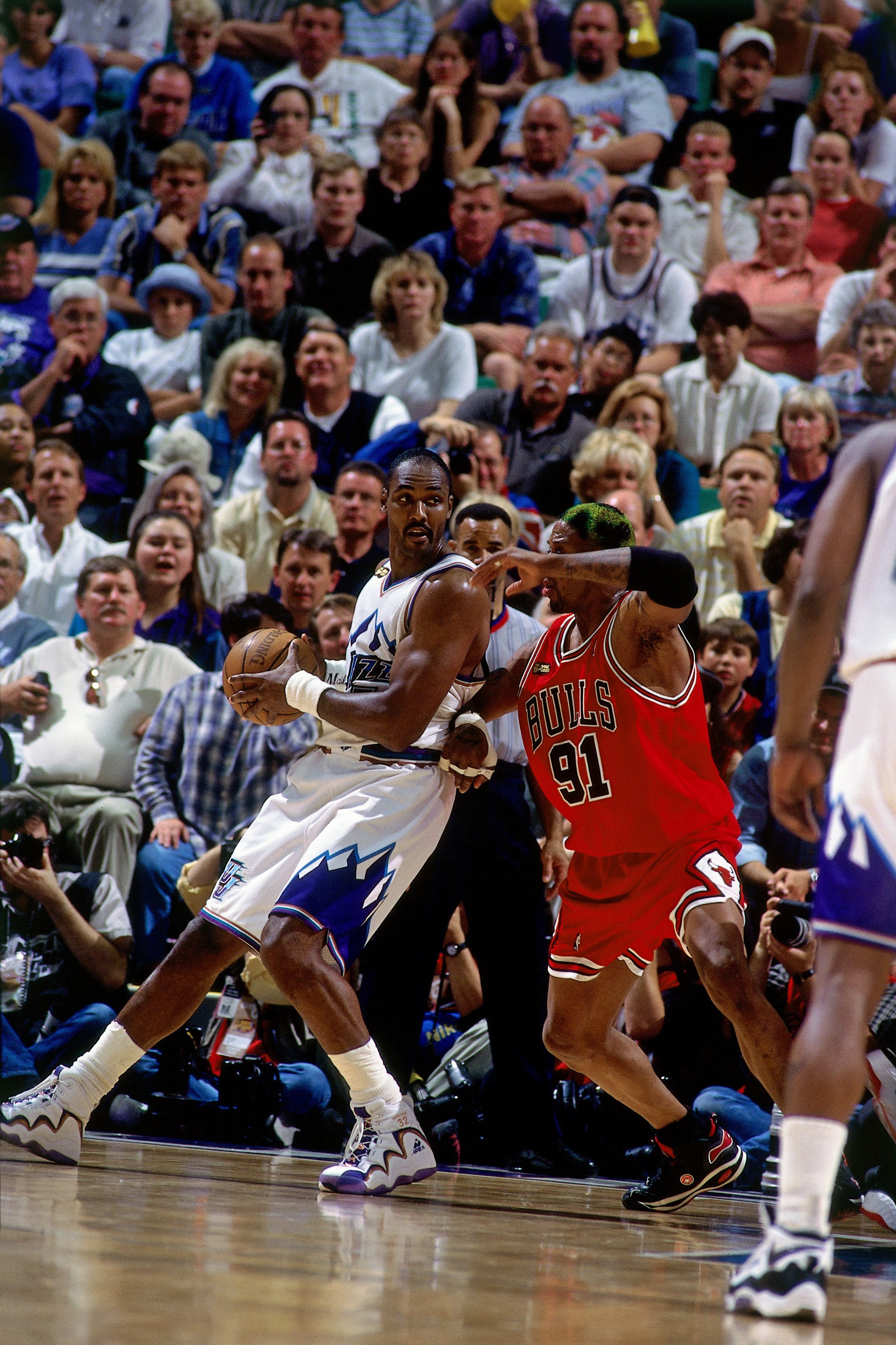 SALT LAKE CITY - JUNE 14:  Karl Malone #32 of Utah Jazz posts up against Dennis Rodman #91 of the Chicago Bulls in Game Six of the 1998 NBA Finals against the Chicago Bulls at the Delta Center on June 14, 1998 in Salt Lake City, Utah.  The Bulls defeated the Jazz 87-86.  NOTE TO USER: User expressly acknowledges that, by downloading and or using this photograph, User is consenting to the terms and conditions of the Getty Images License agreement. Mandatory Copyright Notice: Copyright 1998 NBAE (Photo by Nathaniel S. Butler/NBAE via Getty Images)
