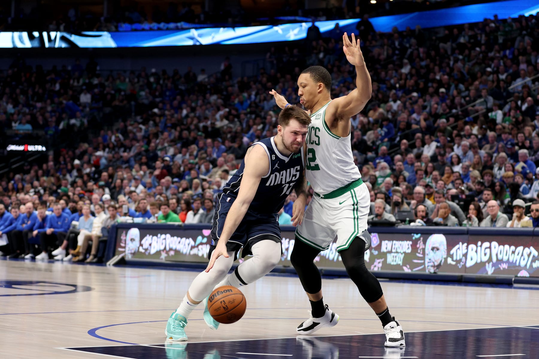 DALLAS, TEXAS - JANUARY 05: Luka Doncic #77 of the Dallas Mavericks drives to the basket against Grant Williams #12 of the Boston Celtics in the second half at American Airlines Center on January 05, 2023 in Dallas, Texas. NOTE TO USER: User expressly acknowledges and agrees that, by downloading and or using this photograph, User is consenting to the terms and conditions of the Getty Images License Agreement. (Photo by Tom Pennington/Getty Images)