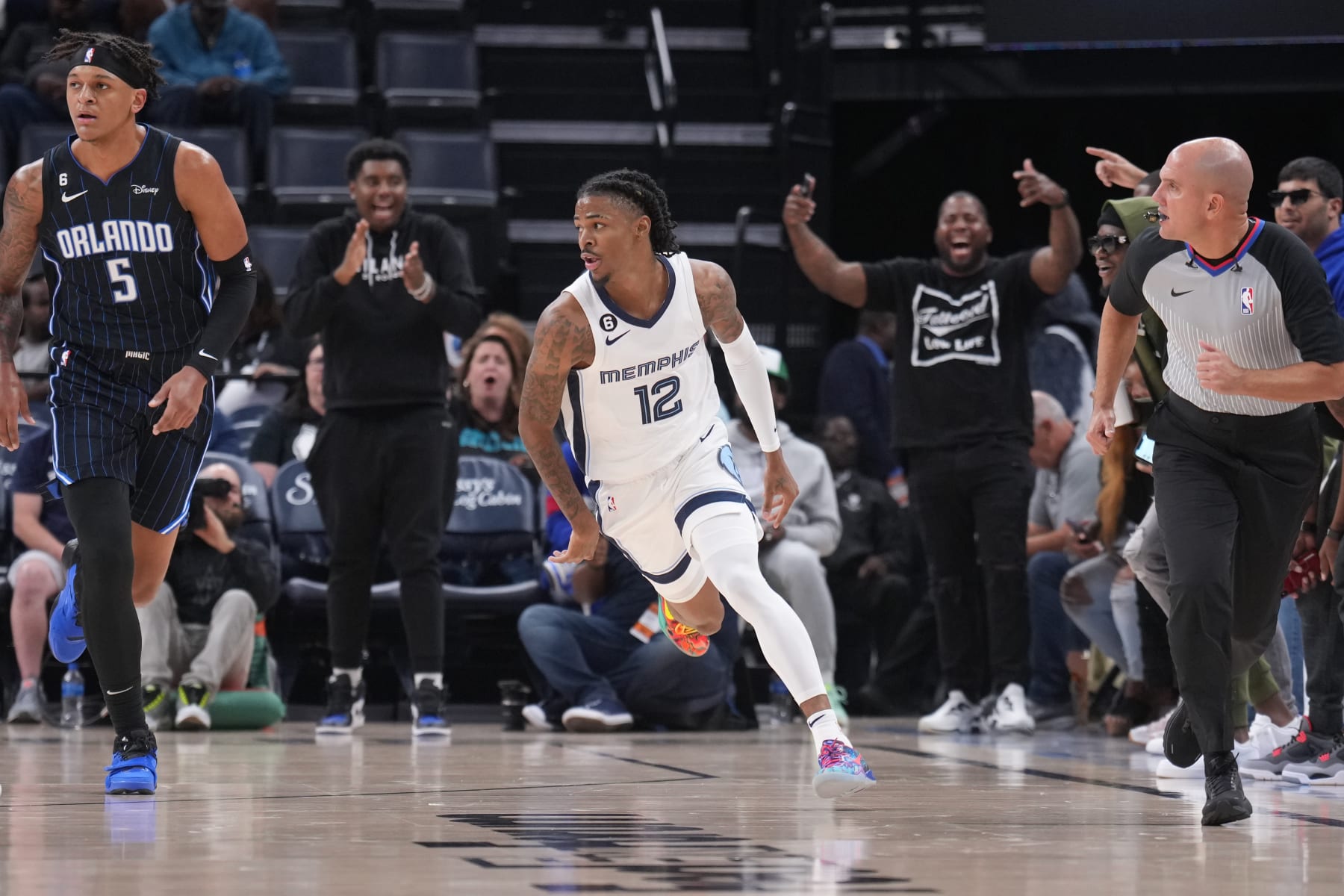 MEMPHIS, TN - OCTOBER 3: Ja Morant #12 of the Memphis Grizzlies celebrates during a preseason game on October 3, 2022 at FedExForum in Memphis, Tennessee. NOTE TO USER: User expressly acknowledges and agrees that, by downloading and or using this photograph, User is consenting to the terms and conditions of the Getty Images License Agreement. Mandatory Copyright Notice: Copyright 2022 NBAE (Photo by Jesse D. Garrabrant/NBAE via Getty Images)