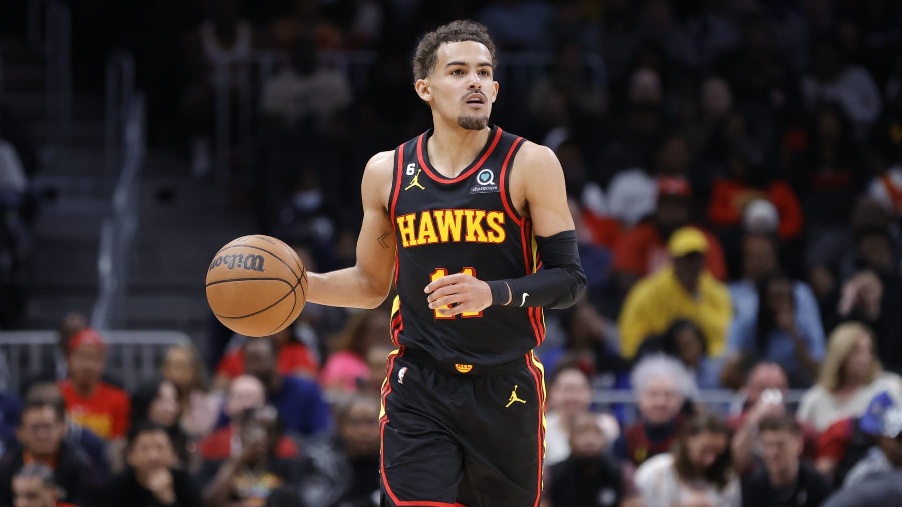 Atlanta Hawks guard Trae Young drives down court during the first half of an NBA basketball game against the Philadelphia 76ers Friday, April 7, 2023, in Atlanta. (AP Photo/Alex Slitz)