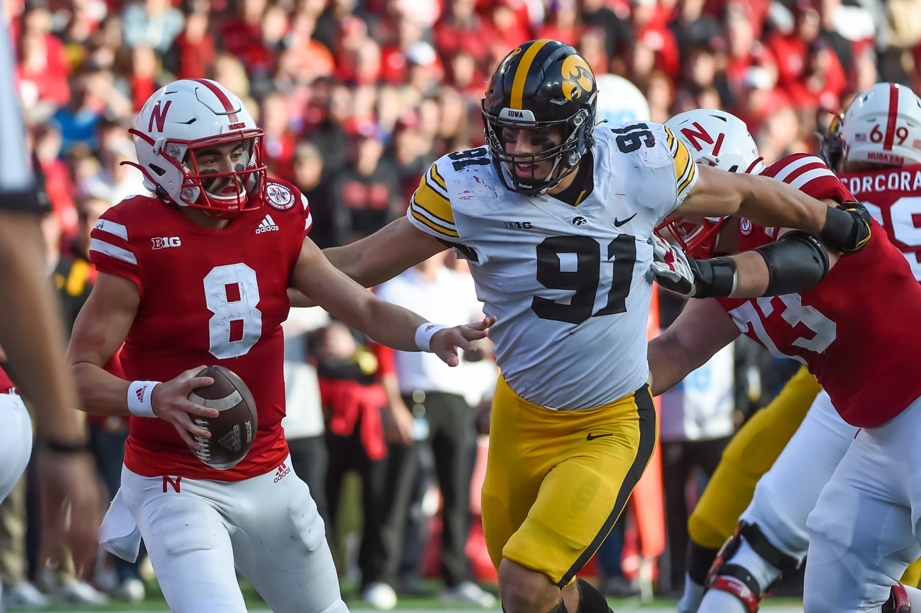 LINCOLN, NE - NOVEMBER 26: Defensive lineman Lukas Van Ness #91 of the Iowa Hawkeyes forces a safety from quarterback Logan Smothers #8 of the Nebraska Cornhuskers in the second half at Memorial Stadium on November 26, 2021 in Lincoln, Nebraska. (Photo by Steven Branscombe/Getty Images)
