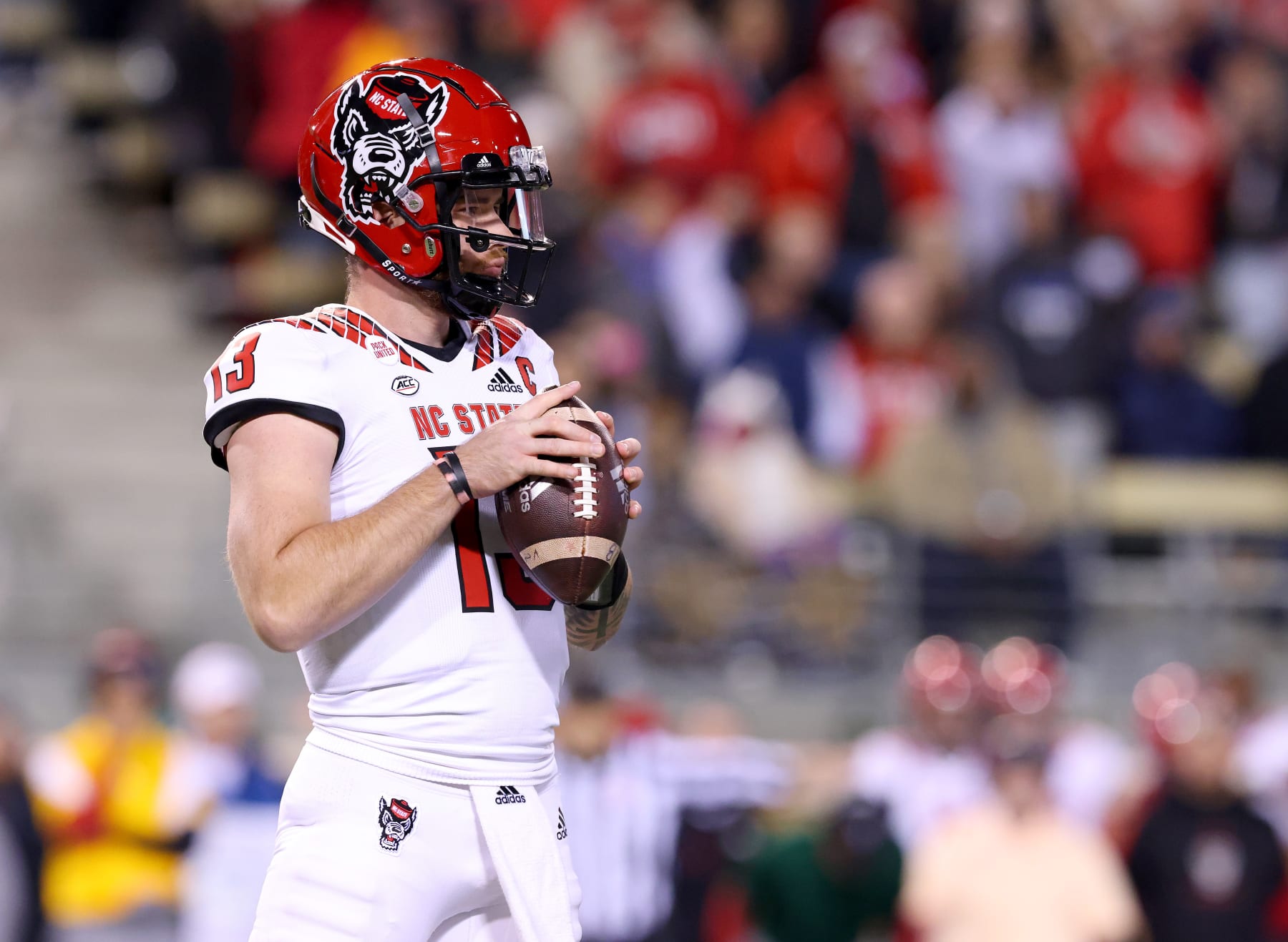WINSTON-SALEM, NORTH CAROLINA - NOVEMBER 13: Devin Leary #13 of the North Carolina State Wolfpack looks on against the Wake Forest Demon Deacons during their game at Truist Field on November 13, 2021 in Winston-Salem, North Carolina. Wake Forest won 45-42. (Photo by Grant Halverson/Getty Images) WINSTON-SALEM, NORTH CAROLINA - NOVEMBER 13: Devin Leary #13 of the North Carolina State Wolfpack looks on against the Wake Forest Demon Deacons during their game at Truist Field on November 13, 2021 in Winston-Salem, North Carolina. Wake Forest won 45-42. (Photo by Grant Halverson/Getty Images)
