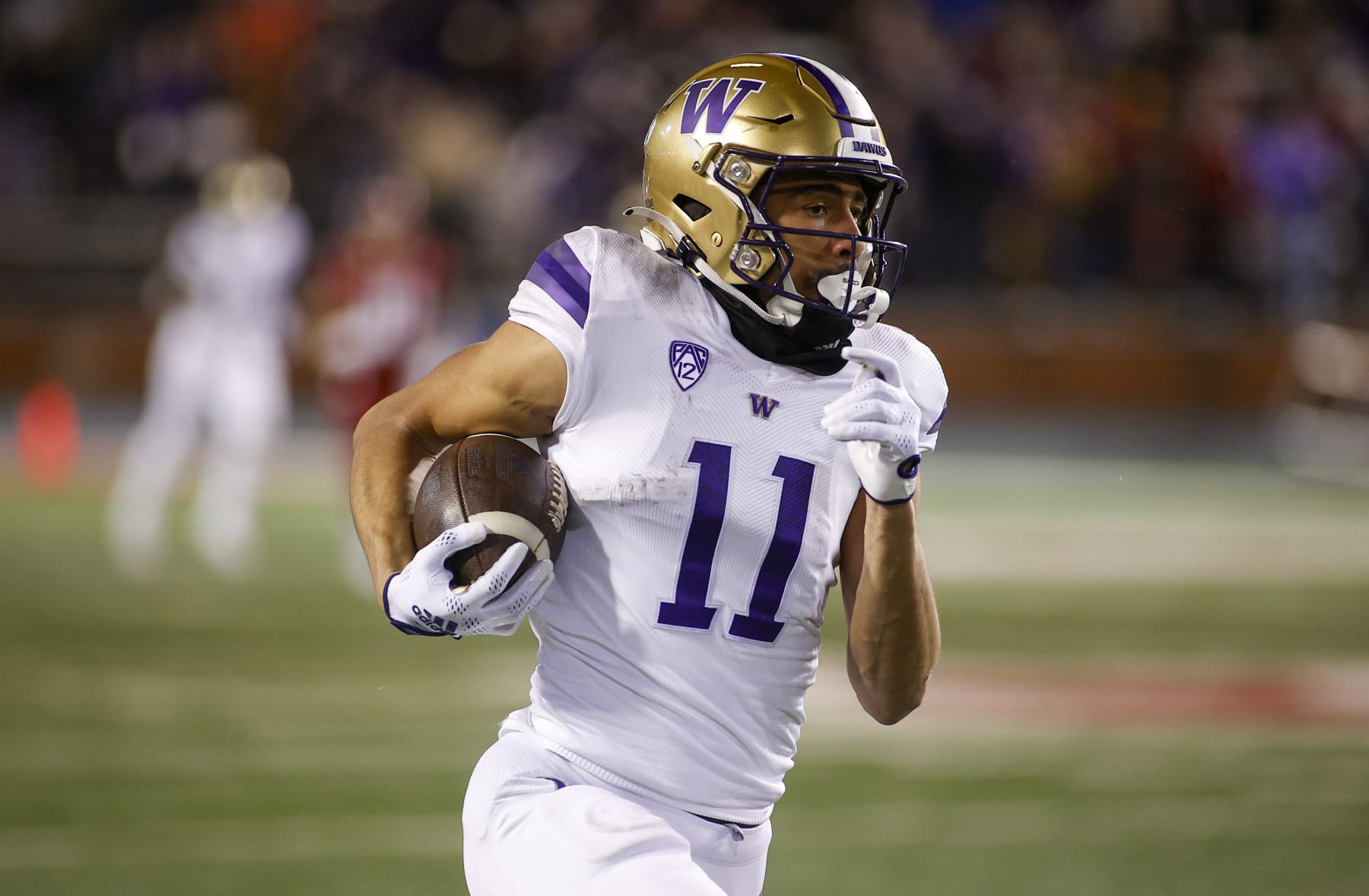 PULLMAN, WA - NOVEMBER 26: Washington Huskies wide receiver Jalen McMillan (11) runs with the ball during the game between the Washington Huskies and the Washington State Cougars on November 26, 2022, at Martin Stadium in Pullman, WA. (Photo by Oliver McKenna/Icon Sportswire via Getty Images)