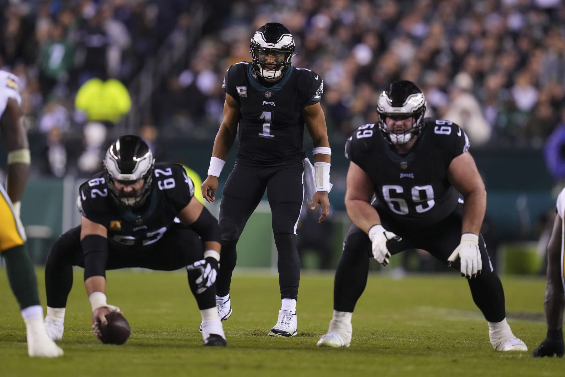 PHILADELPHIA, PA - NOVEMBER 27: Jason Kelce #62, Landon Dickerson #69, and Jalen Hurts #1 of the Philadelphia Eagles look on against the Green Bay Packers at Lincoln Financial Field on November 27, 2022 in Philadelphia, Pennsylvania. (Photo by Mitchell Leff/Getty Images)