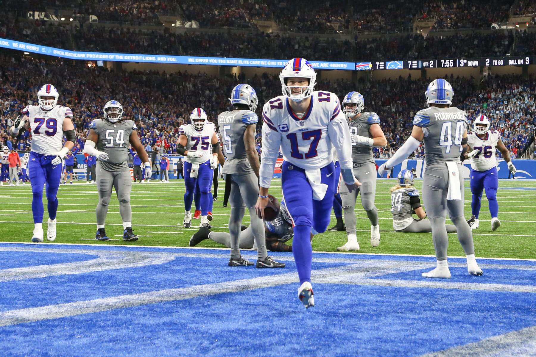 DETROIT, MI - NOVEMBER 24:  Buffalo Bills quarterback Josh Allen (17) runs with the ball into the end zone for a touchdown during a regular season NFL football game between the Buffalo Bills and the Detroit Lions on Thanksgiving Day on November 24, 2022 at Ford Field in Detroit, Michigan.  (Photo by Scott W. Grau/Icon Sportswire via Getty Images)