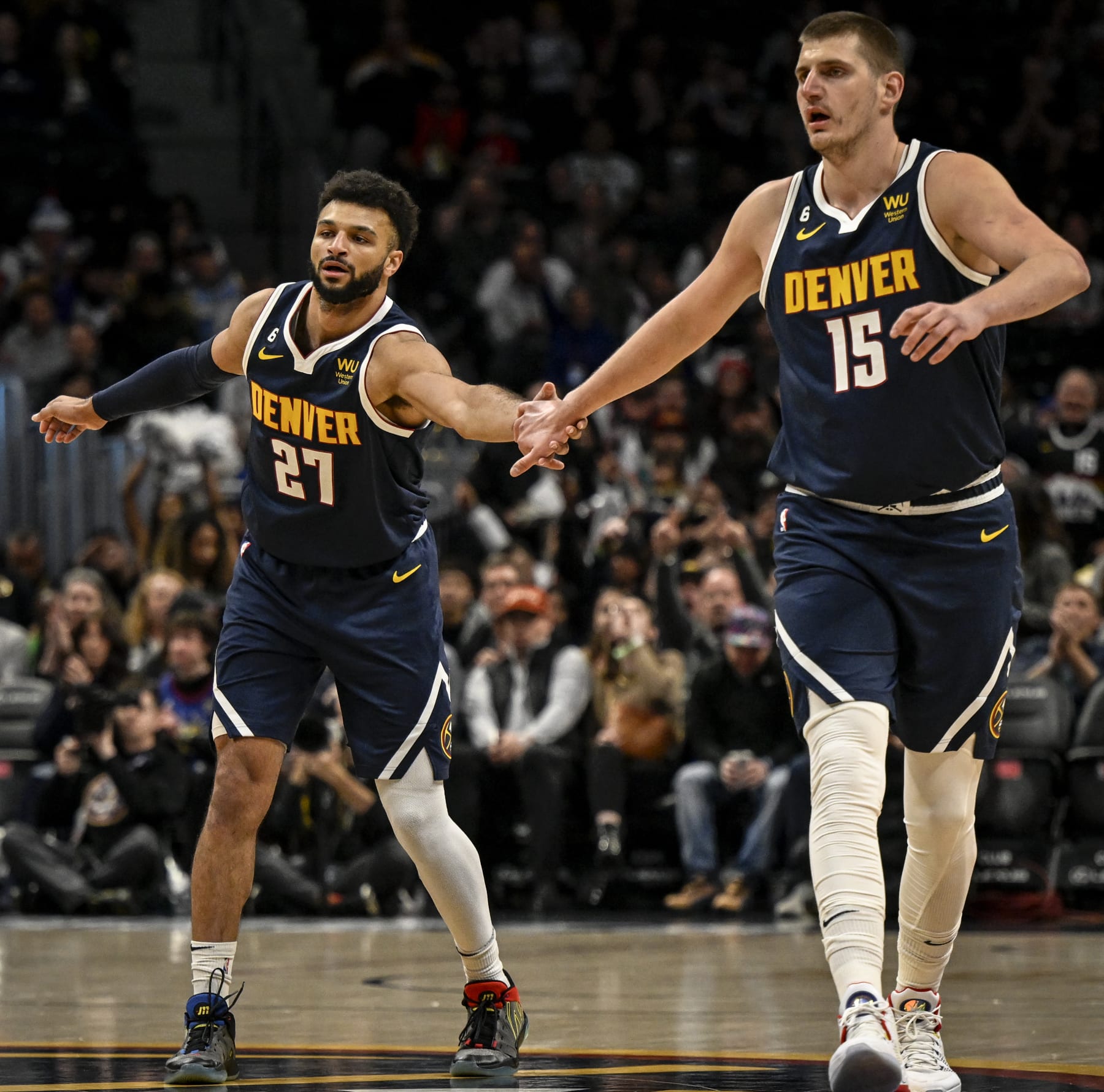 DENVER, CO - JANUARY 17: Jamal Murray (27) of the Denver Nuggets high fives Nikola Jokic (15) after hitting a three against the Portland Trail Blazers during the first quarter at Ball Arena in Denver on Tuesday, January 17, 2023. (Photo by AAron Ontiveroz/MediaNews Group/The Denver Post via Getty Images)
