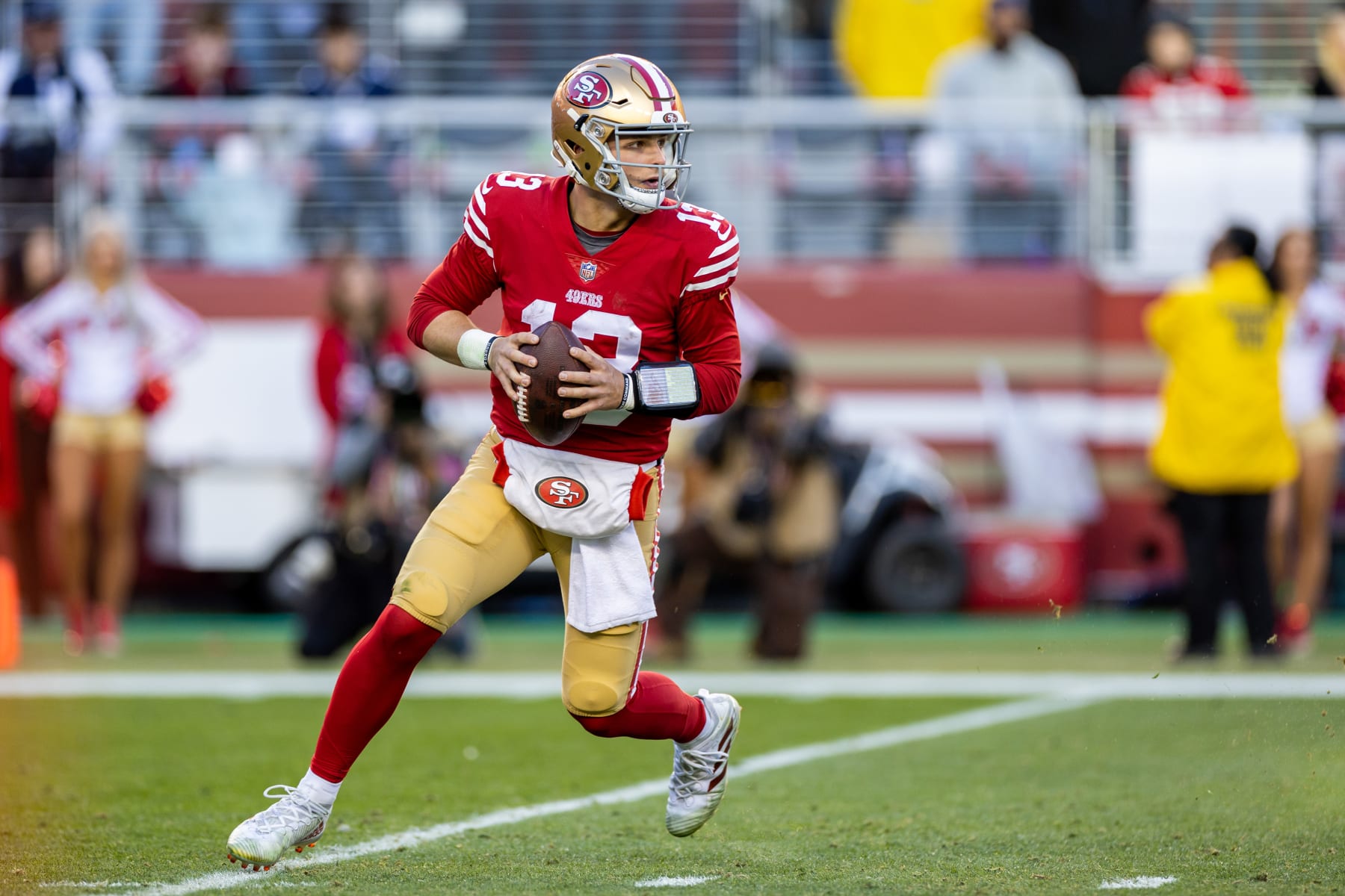 SANTA CLARA, CA - JANUARY 22: San Francisco 49ers quarterback Brock Purdy (13) scrambles during the NFL NFC Divisional Playoff game between the Dallas Cowboys and San Francisco 49ers at Levis Stadium in Santa Clara, CA. (Photo by Bob Kupbens/Icon Sportswire via Getty Images)