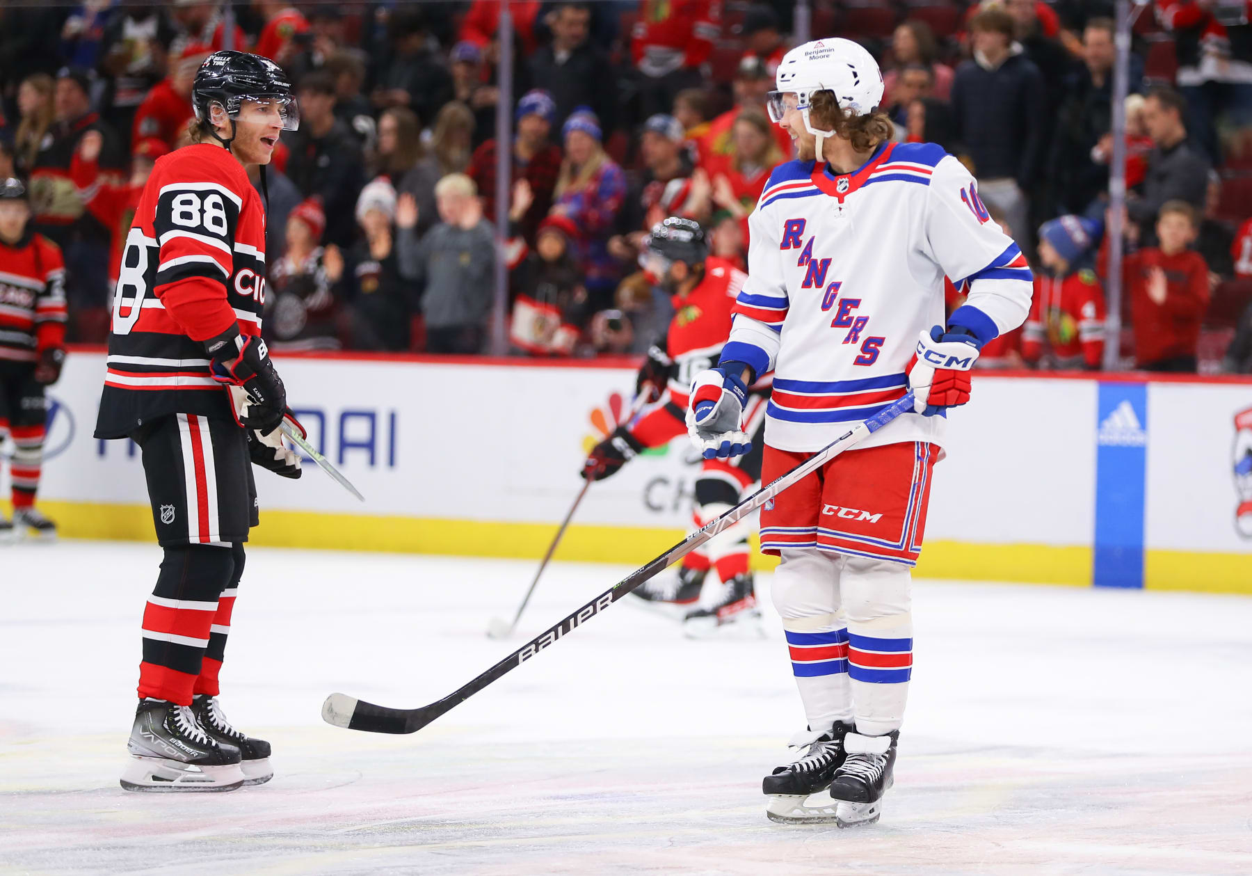 CHICAGO, IL - DECEMBER 18: Chicago Blackhawks Right Wing Patrick Kane (88) and New York Rangers Left Wing Artemi Panarin (10) chat during warm-ups before a game between the New York Rangers and the Chicago Blackhawks on December 18, 2022 at the United Center in Chicago, IL. (Photo by Melissa Tamez/Icon Sportswire via Getty Images)