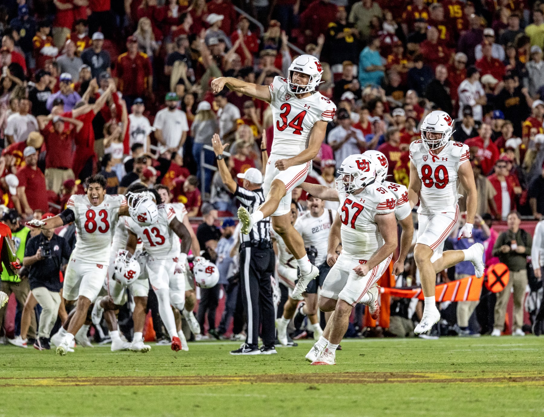 LOS ANGELES, CA  - OCTOBER 21, 2023:  Utah Utes celebrate after place kicker Cole Becker (36) kicked the game winning field goal to beat USC 34-32 at LA Memorial Coliseum on October 21,  2023 in Los Angeles, California. (Gina Ferazzi / Los Angeles Times via Getty Images)