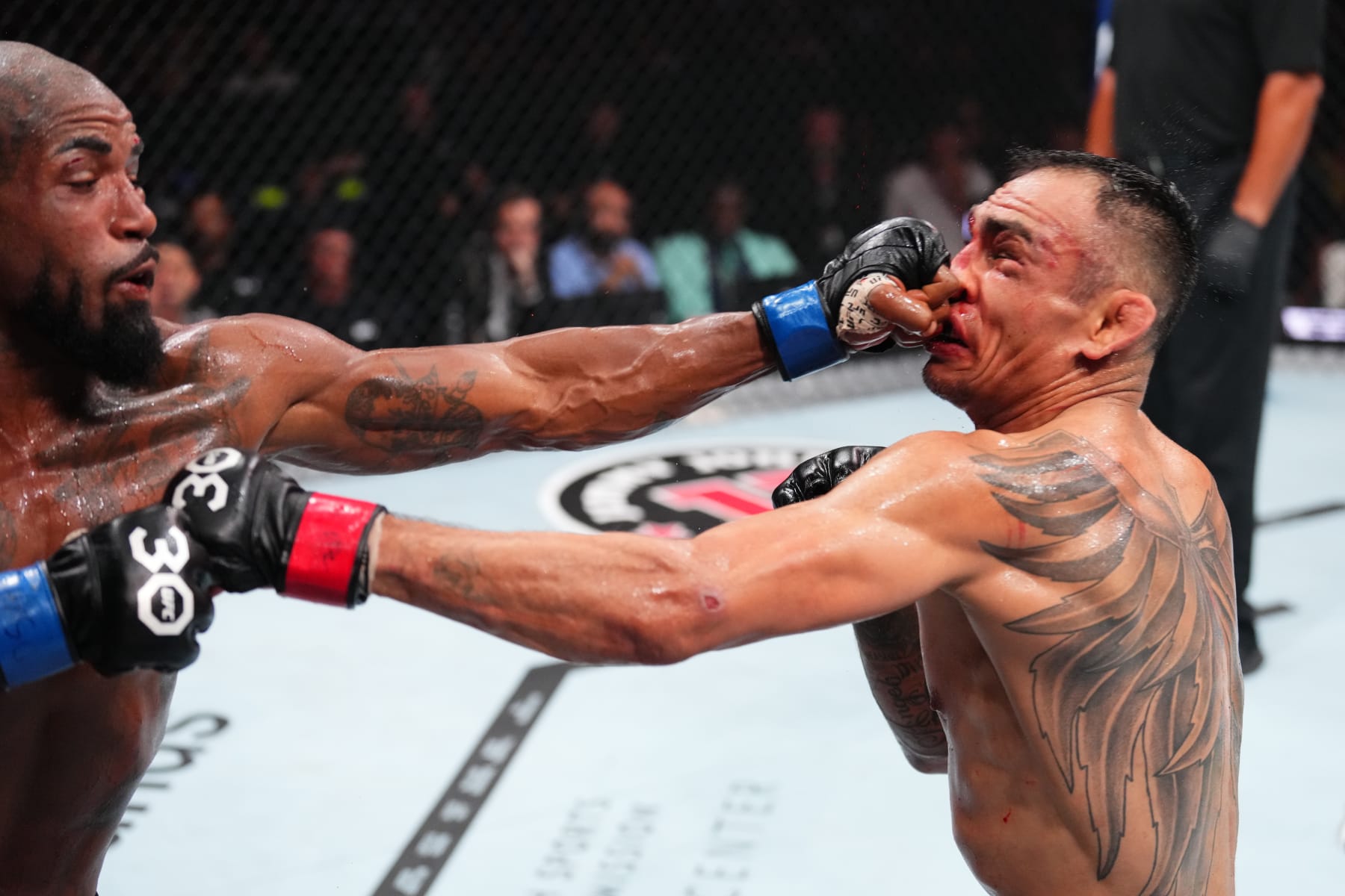 SALT LAKE CITY, UTAH - JULY 29: (L-R) Bobby Green punches Tony Ferguson in a lightweight fight during the UFC 291 event at Delta Center on July 29, 2023 in Salt Lake City, Utah. (Photo by Josh Hedges/Zuffa LLC via Getty Images)