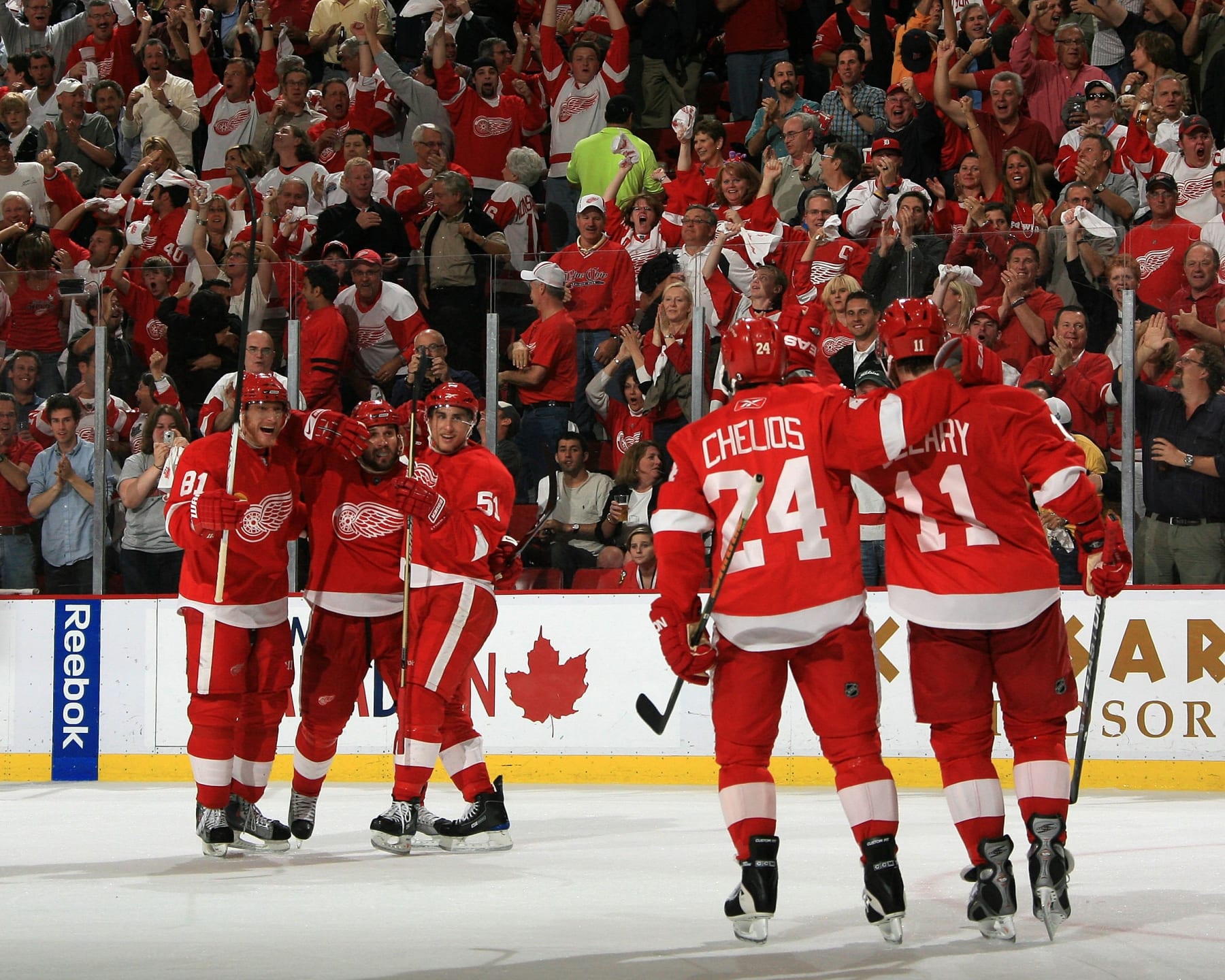 DETROIT - MAY 27: Marian Hossa #81, Brett Lebda #22 and Valtteri Filppula #51 of the Detroit Red Wings wait for teamates Chris Chelios #24 and Dan Cleary #11 to skate over after a Cleary goal during Game Five of the Western Conference Championship Round of the 2009 Stanley Cup Playoffs against the Chicago Blackhawks on May 27, 2009 at Joe Louis Arena in Detroit, Michigan. The Red Wings defeated the Blackhawks 2-1 in overtime  (Photo by Dave Reginek/NHLI via Getty Images)