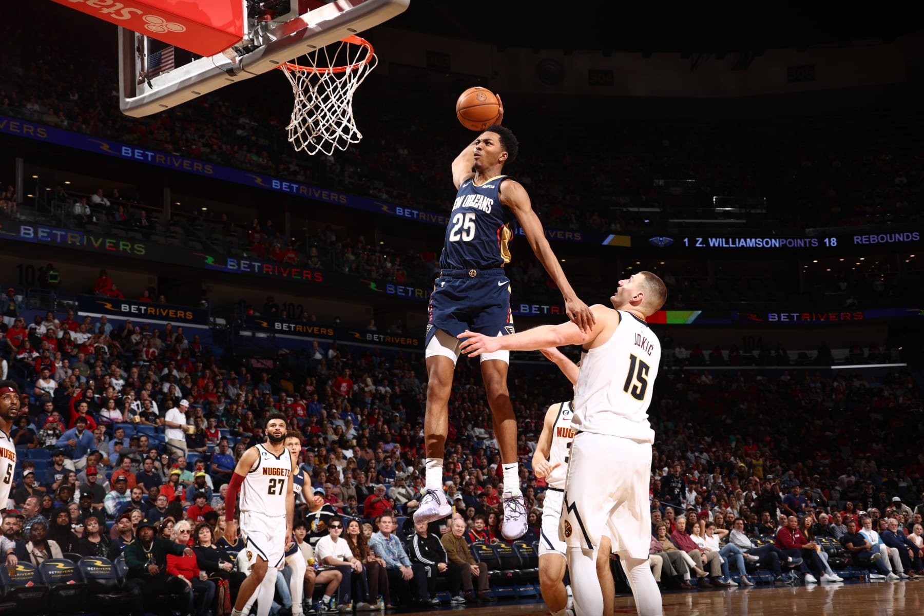 NEW ORLEANS, LA - DECEMBER 4: Trey Murphy III #25 of the New Orleans Pelicans dunks the ball during the game against the Denver Nuggets on December 4, 2022 at the Smoothie King Center in New Orleans, Louisiana. NOTE TO USER: User expressly acknowledges and agrees that, by downloading and or using this Photograph, user is consenting to the terms and conditions of the Getty Images License Agreement. Mandatory Copyright Notice: Copyright 2022 NBAE (Photo by Ned Dishman/NBAE via Getty Images)