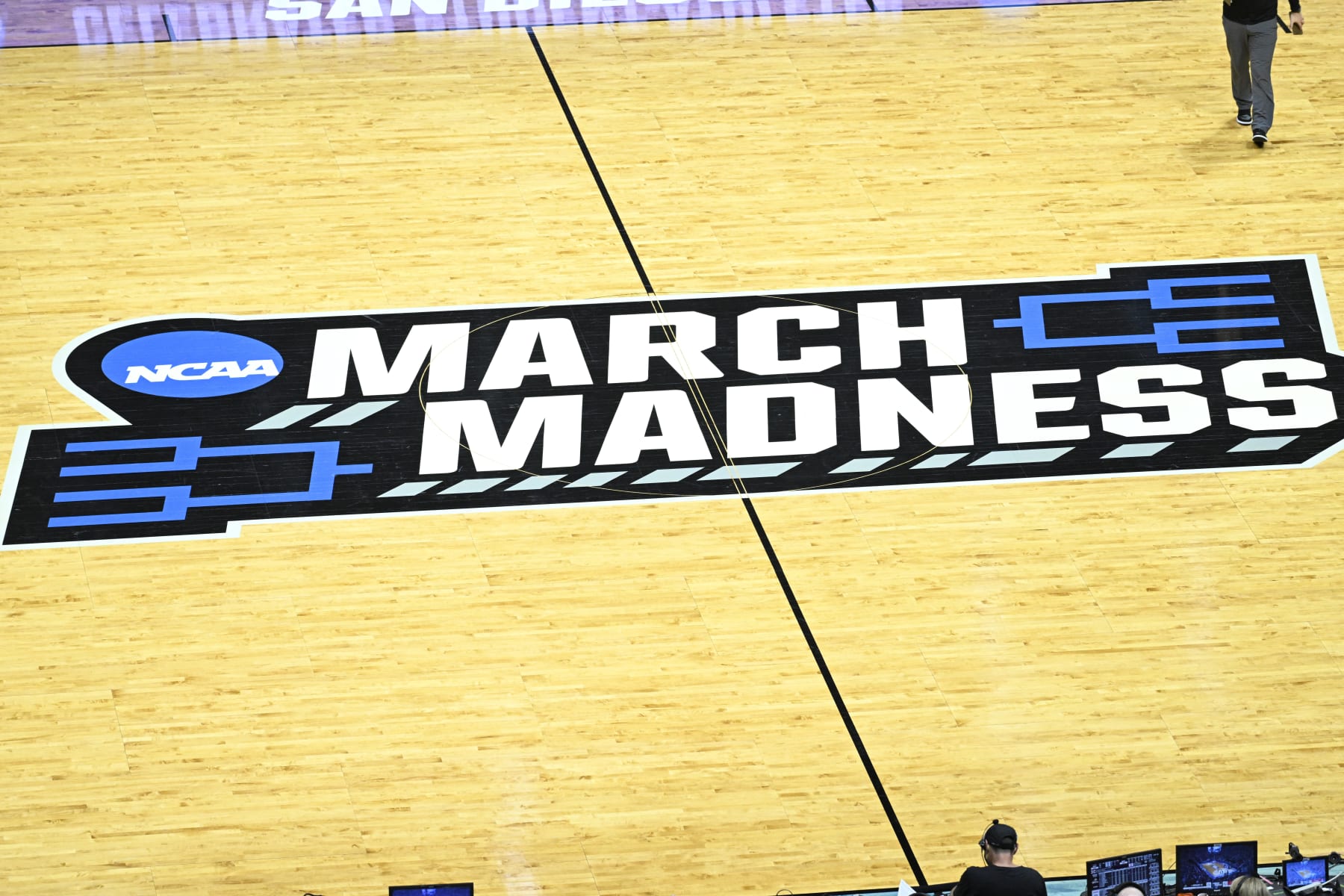 The March Madness logo is shown on the court during a break in a first-round NCAA college basketball tournament game between Arizona and Wright State, Friday, March 18, 2022, in San Diego. (AP Photo/Denis Poroy)
