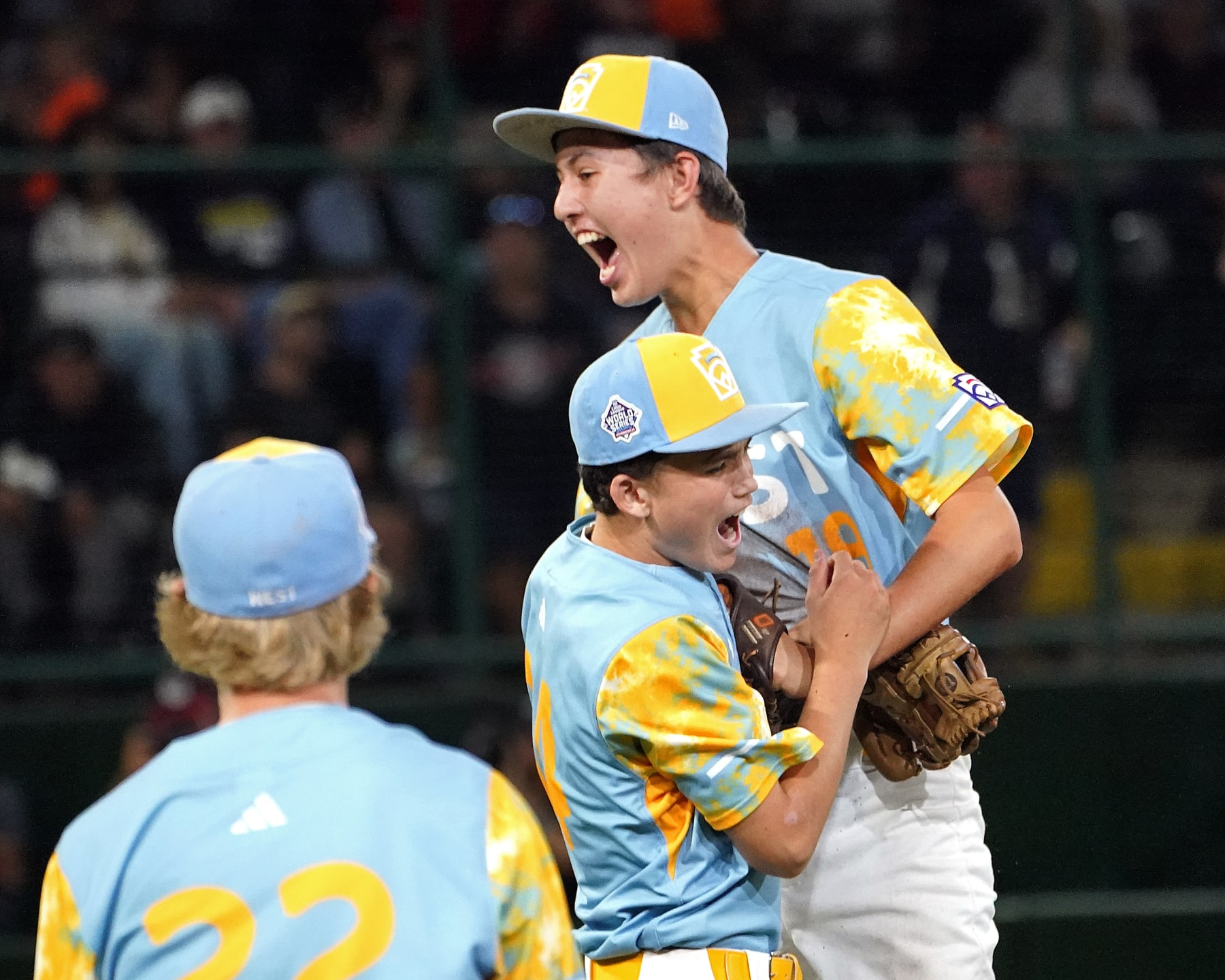 El Segundo, Calif.'s Brody Brooks, left, and Louis Lappe (19) celebrate the the team's win against Nolensville, Tenn., during a baseball game at the Little League World Series in South Williamsport, Pa., Wednesday, Aug. 23, 2023. (AP Photo/Tom E. Puskar)