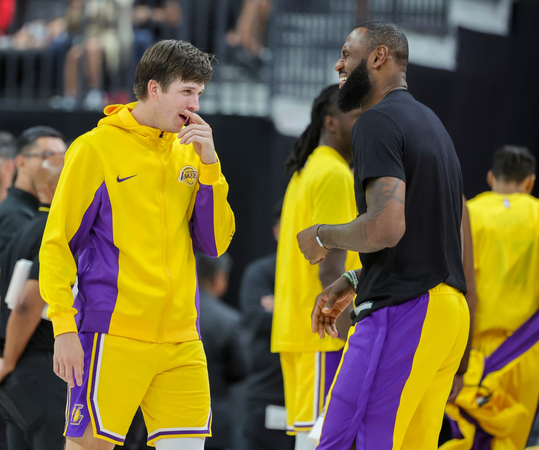 LAS VEGAS, NEVADA - OCTOBER 09: Austin Reaves (L) #15 and LeBron James #23 of the Los Angeles Lakers talk during a break in the fourth quarter of their preseason game against the Brooklyn Nets at T-Mobile Arena on October 09, 2023 in Las Vegas, Nevada. The Lakers defeated the Nets 129-126. NOTE TO USER: User expressly acknowledges and agrees that, by downloading and or using this photograph, User is consenting to the terms and conditions of the Getty Images License Agreement. (Photo by Ethan Miller/Getty Images)