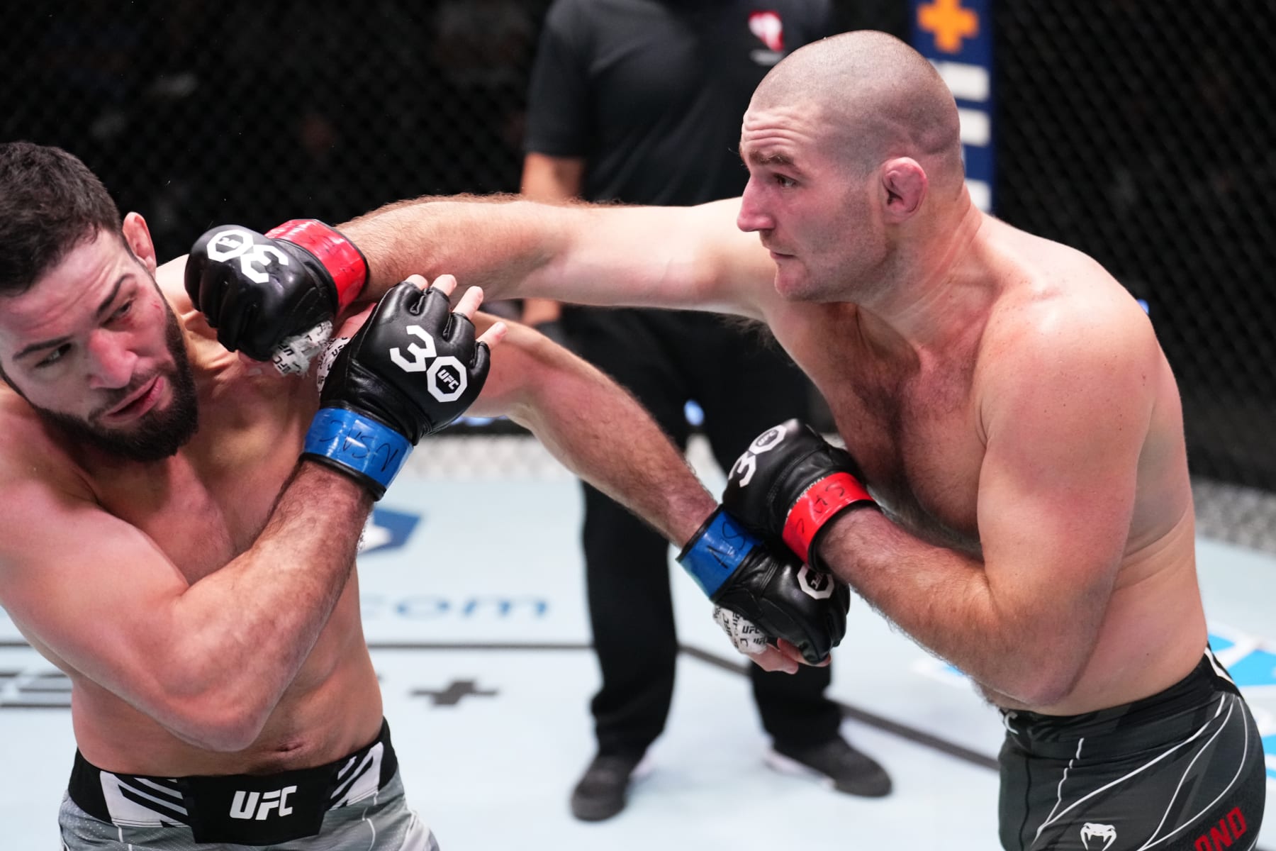 LAS VEGAS, NEVADA - JANUARY 14: (R-L) Sean Strickland punches Nassourdine Imavov of Russia in a light heavyweight fight during the UFC Fight Night event at UFC APEX on January 14, 2023 in Las Vegas, Nevada. (Photo by Chris Unger/Zuffa LLC via Getty Images)