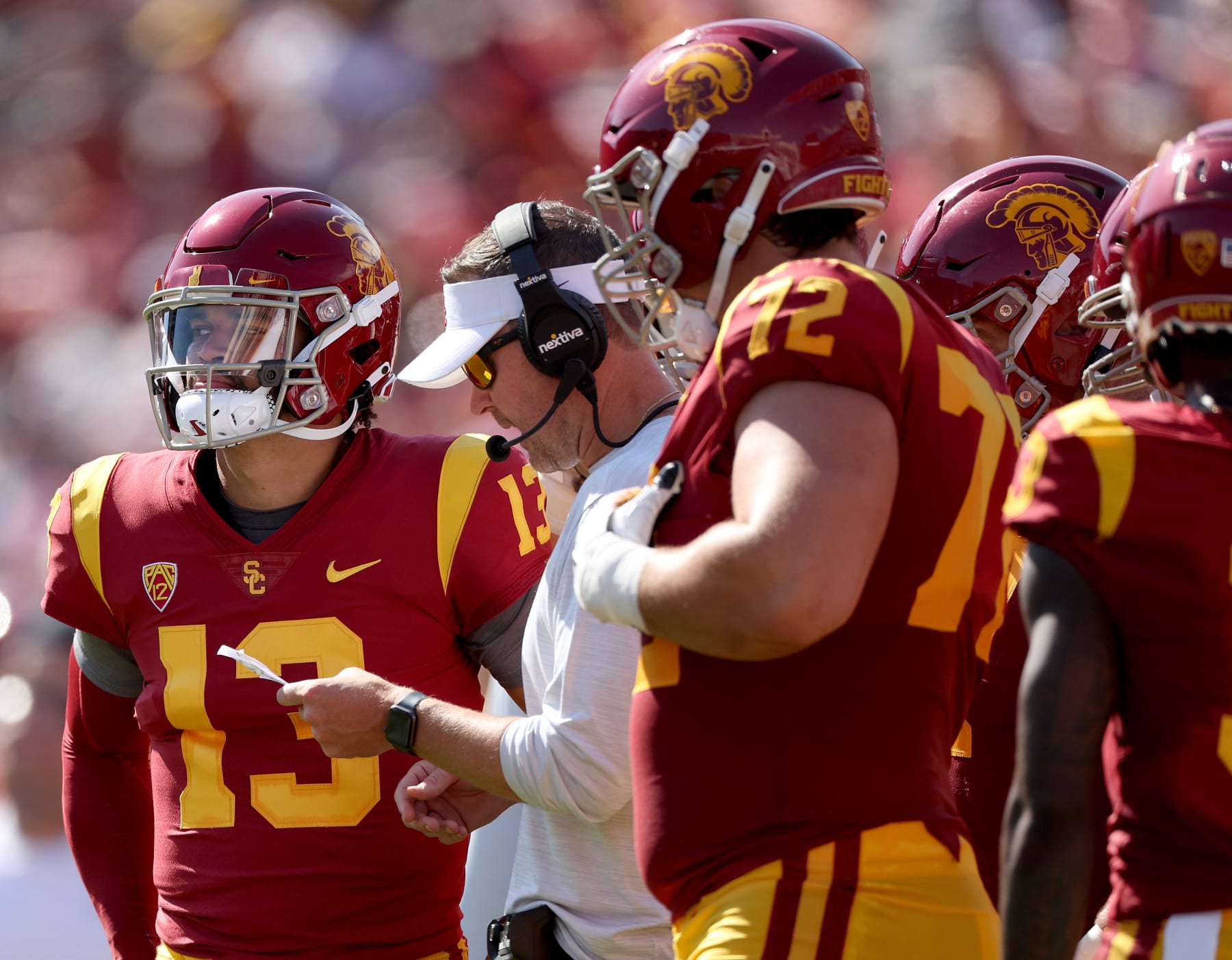 LOS ANGELES, CALIFORNIA - SEPTEMBER 03: Caleb Williams #13 of the USC Trojans listens to head coach Lincoln Riley during the second quarter against the Rice Owls at United Airlines Field at the Los Angeles Memorial Coliseum on September 03, 2022 in Los Angeles, California. (Photo by Harry How/Getty Images)