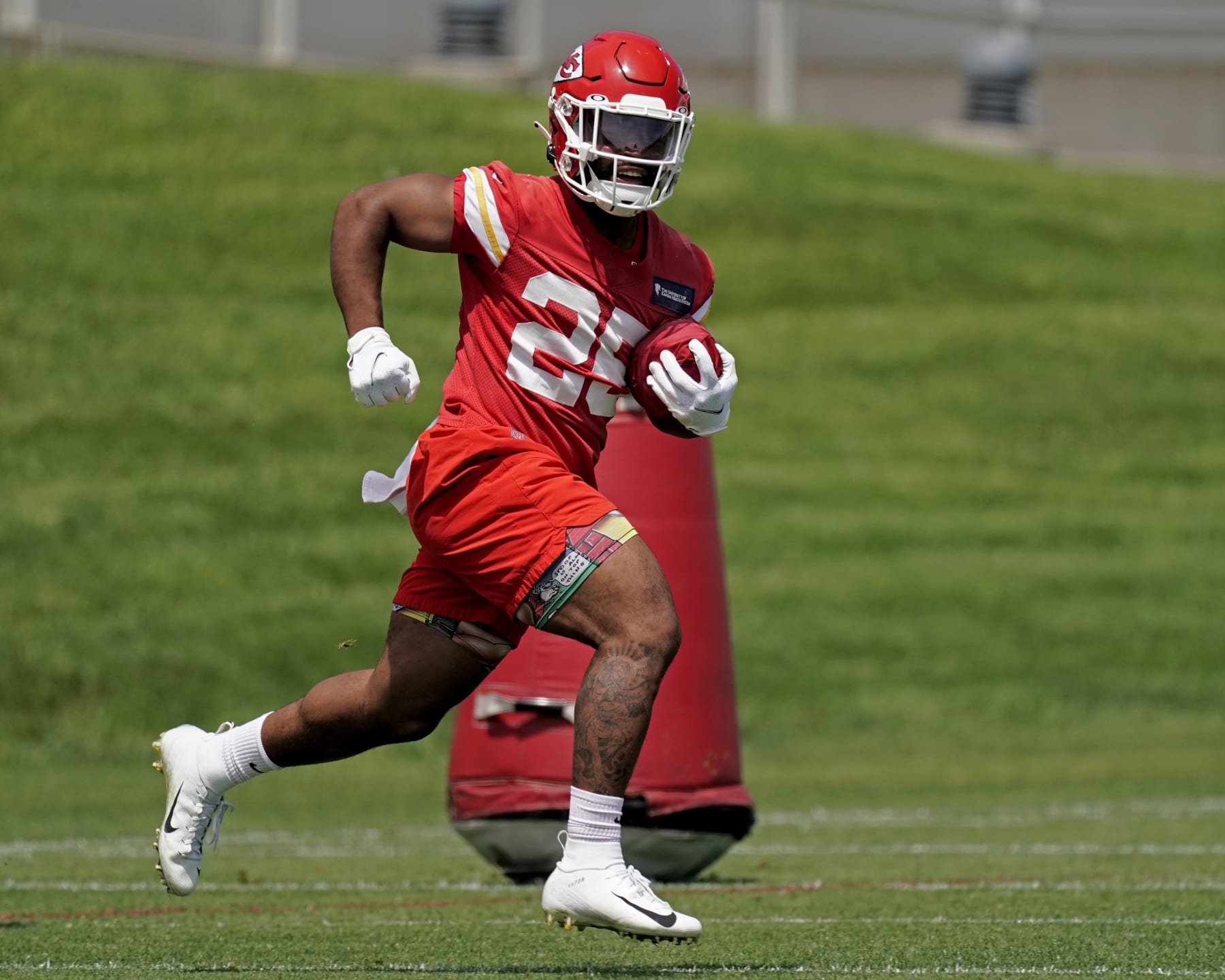 Kansas City Chiefs running back Clyde Edwards-Helaire runs a drill during the NFL football team's organized team activities Thursday, June 2, 2022, in Kansas City, Mo. (AP Photo/Charlie Riedel)