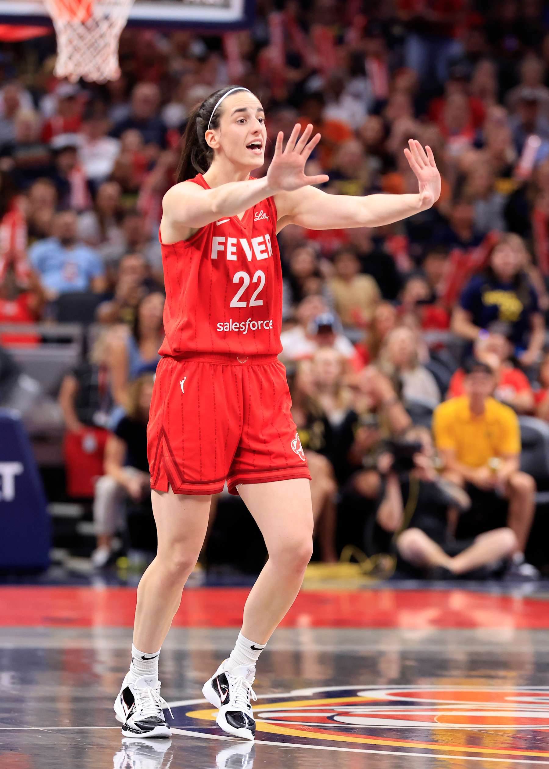 INDIANAPOLIS, INDIANA - AUGUST 16:  Caitlin Clark #22 of the Indiana Fever directs her team in the game against the Phoenix Mercury at Gainbridge Fieldhouse on August 16, 2024 in Indianapolis, Indiana. NOTE TO USER: User expressly acknowledges and agrees that, by downloading and or using this photograph, User is consenting to the terms and conditions of the Getty Images License Agreement. (Photo by Justin Casterline/Getty Images)