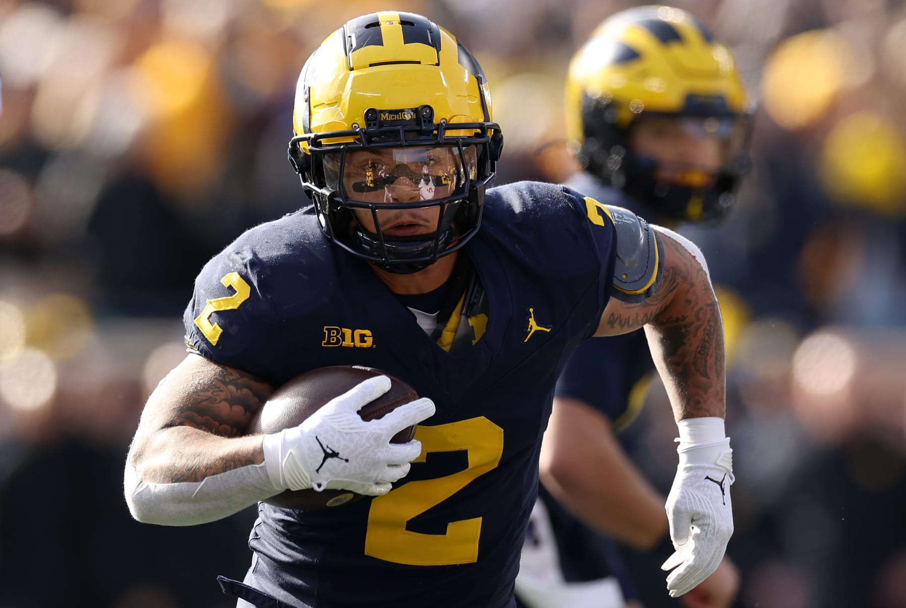 ANN ARBOR, MICHIGAN - NOVEMBER 25: Blake Corum #2 of the Michigan Wolverines runs the ball against the Ohio State Buckeyes during the first quarter in the game at Michigan Stadium on November 25, 2023 in Ann Arbor, Michigan. (Photo by Ezra Shaw/Getty Images)